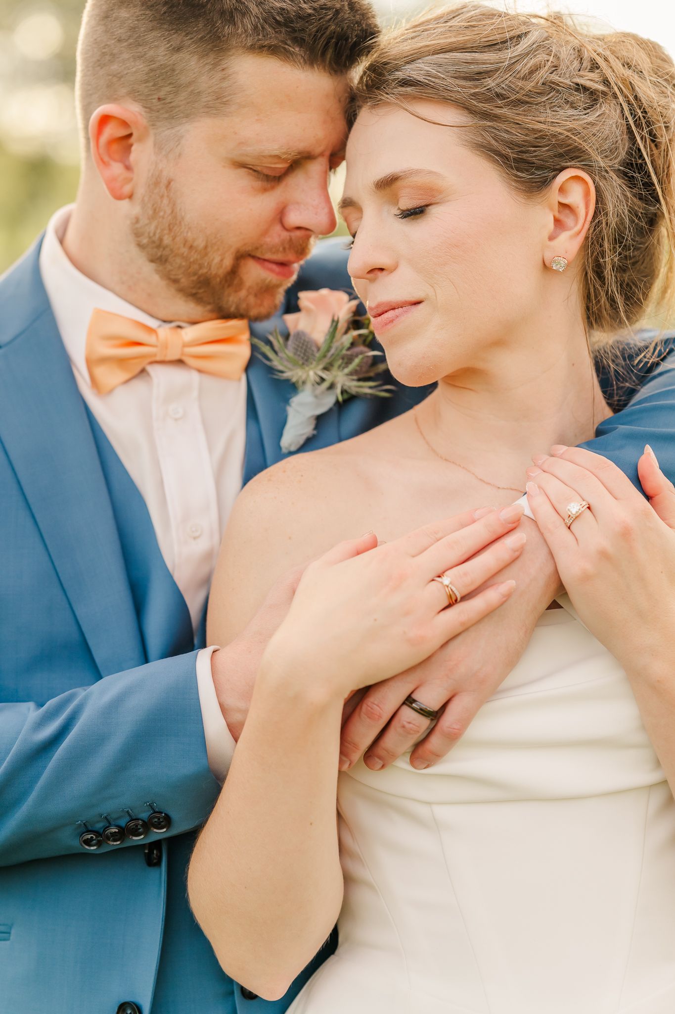 Groom and bride sharing a tender moment with eyes closed. The Old Barns at Dry Run Farms in Williamsport, Ohio.