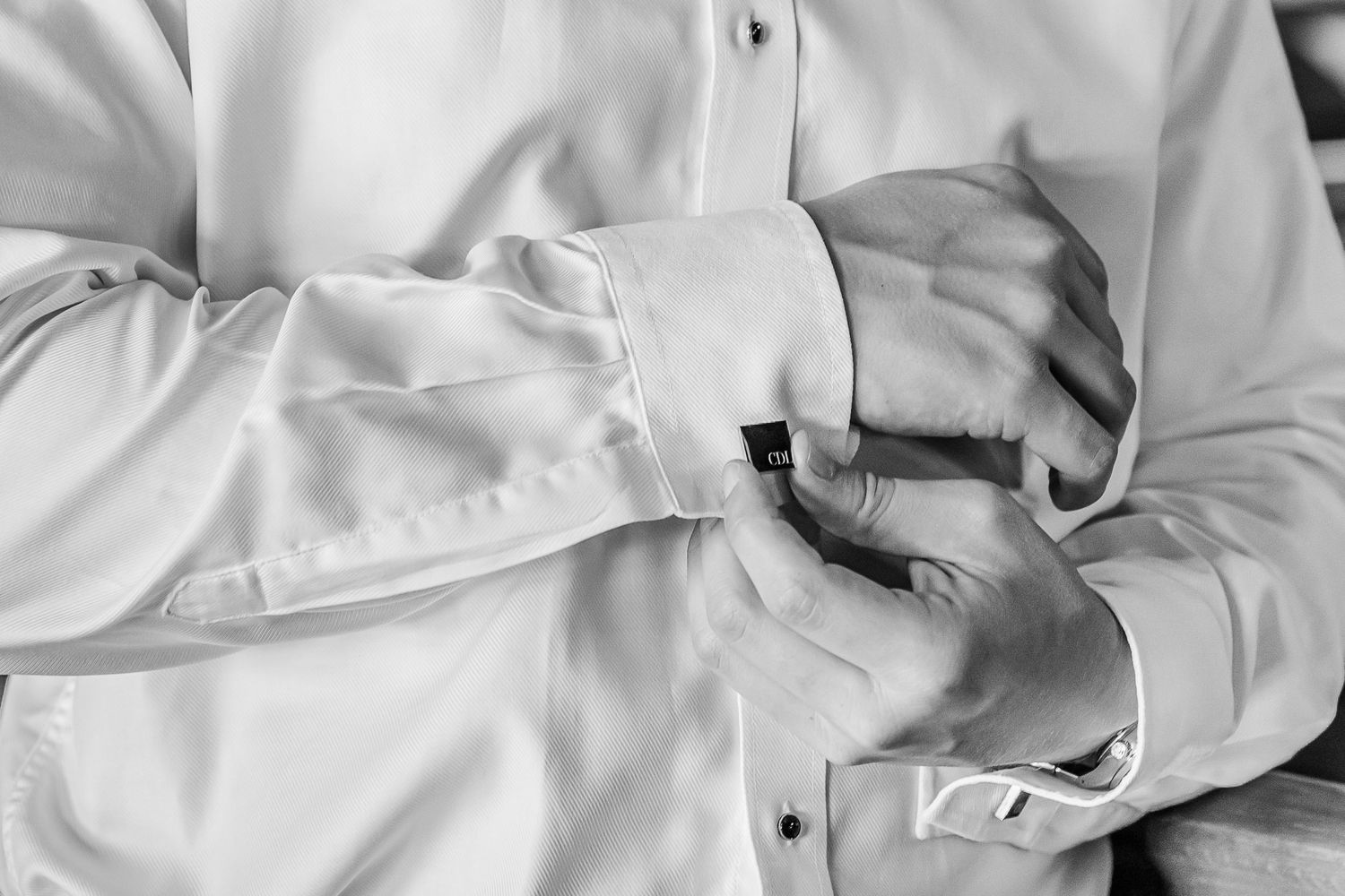 A sequence of white fabric details showing folds, seams, and buttons in close-up shots. The Old Barns at Dry Run Farms in Williamsport, OH.