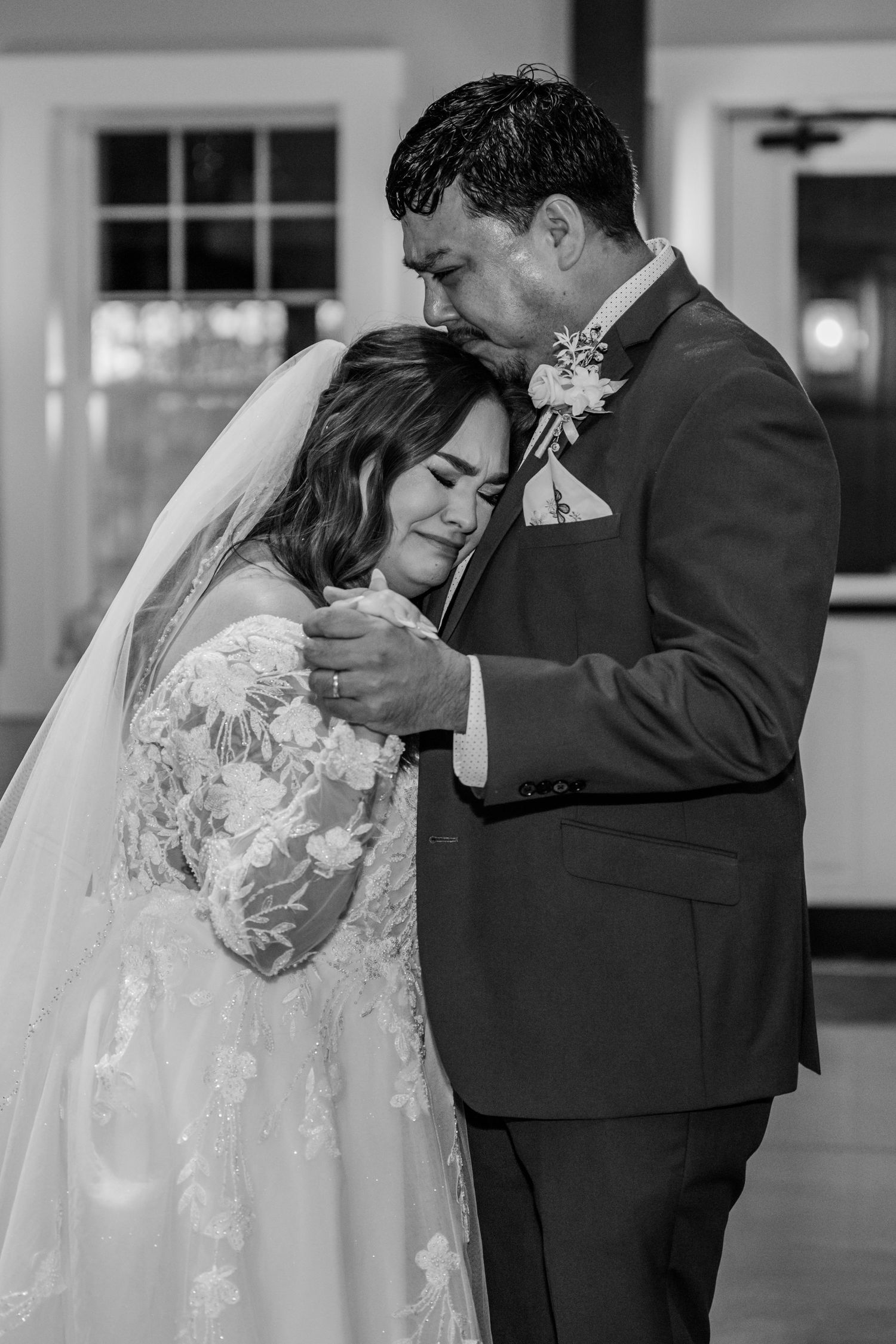 Black and white wedding photos showing intimate moments during a romantic first dance.Four Seasons Barn Wedding & Event Venue