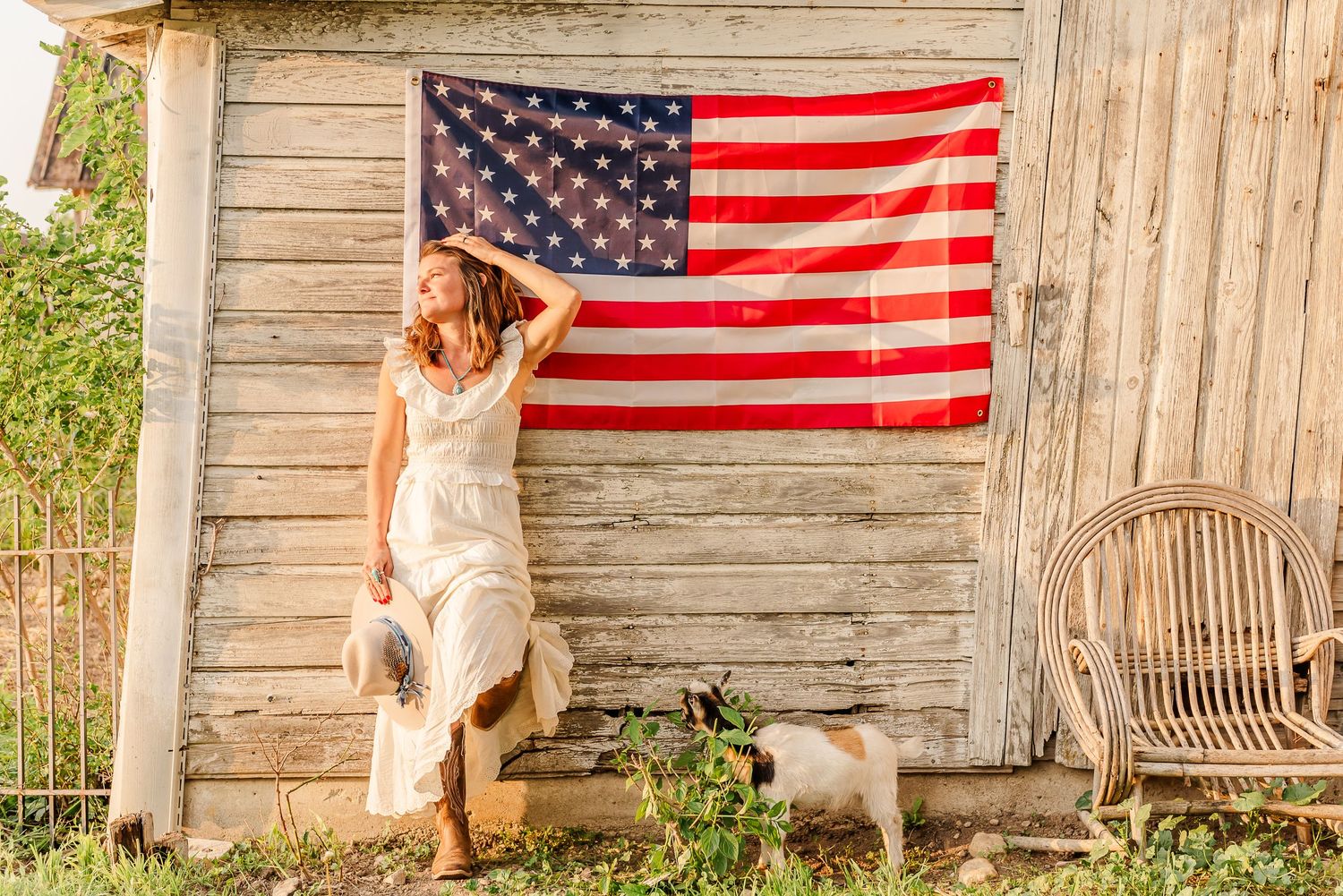 A series of patriotic photos showing an American flag displayed against a rustic wooden barn wall.