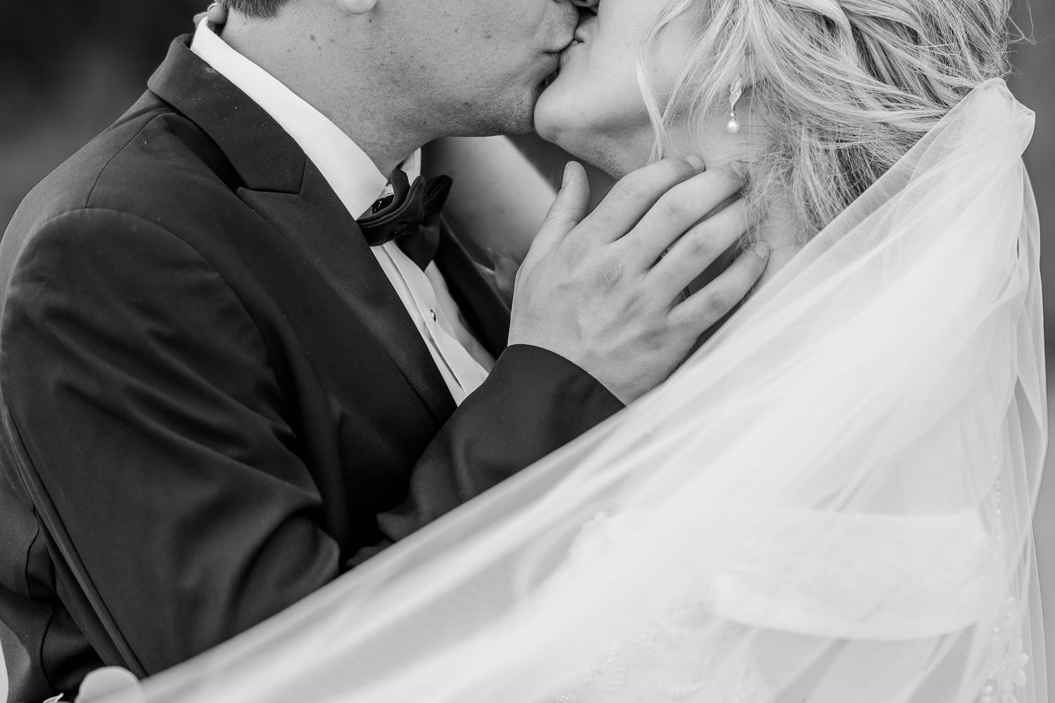 A romantic black and white wedding photo collage showing intimate moments between newlyweds. The Old Barns at Dry Run Farms in Williamsport