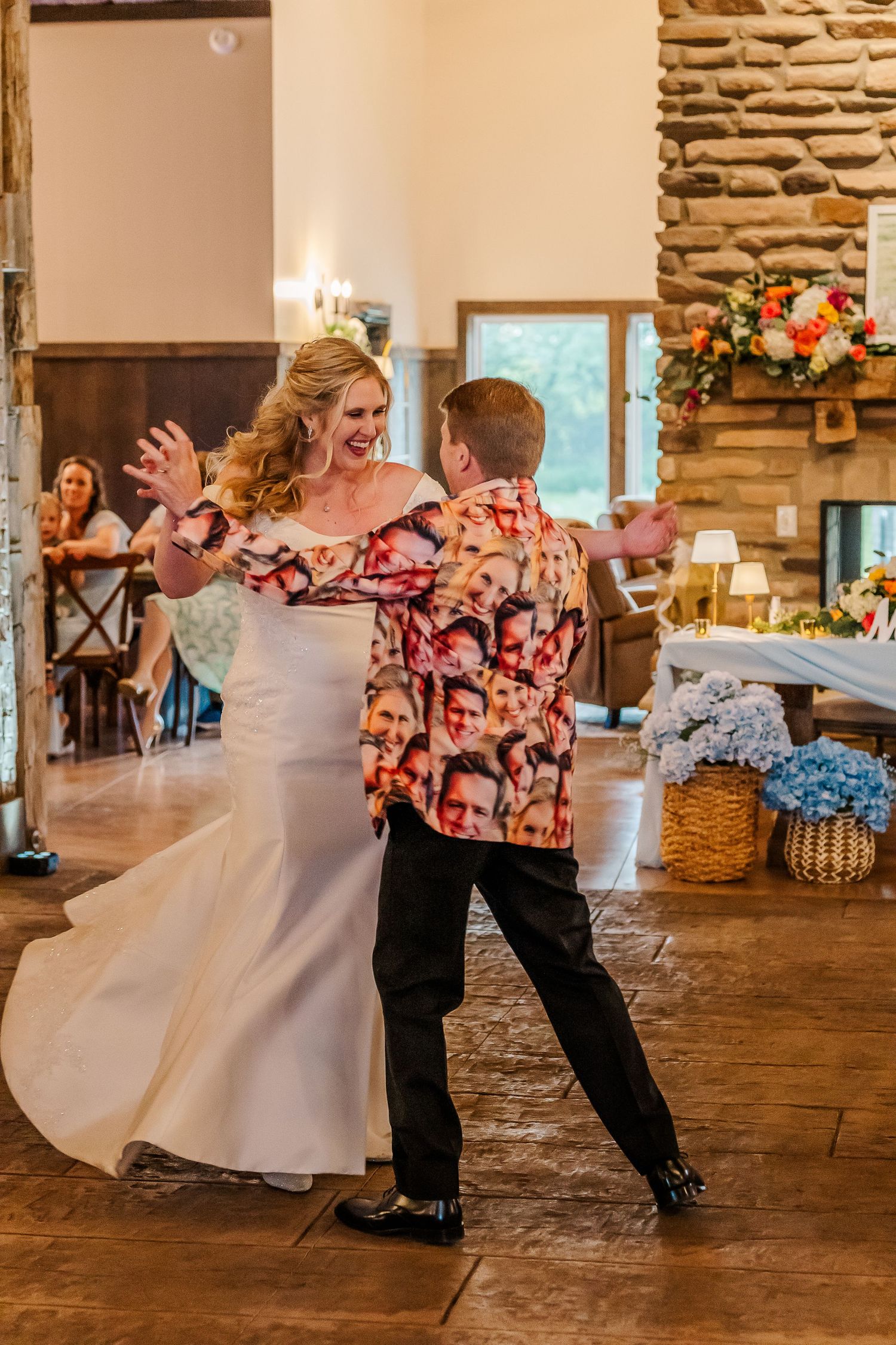 Wedding dancers perform an upbeat swing dance sequence with dramatic dips and spins on a rustic wooden dance floor.
