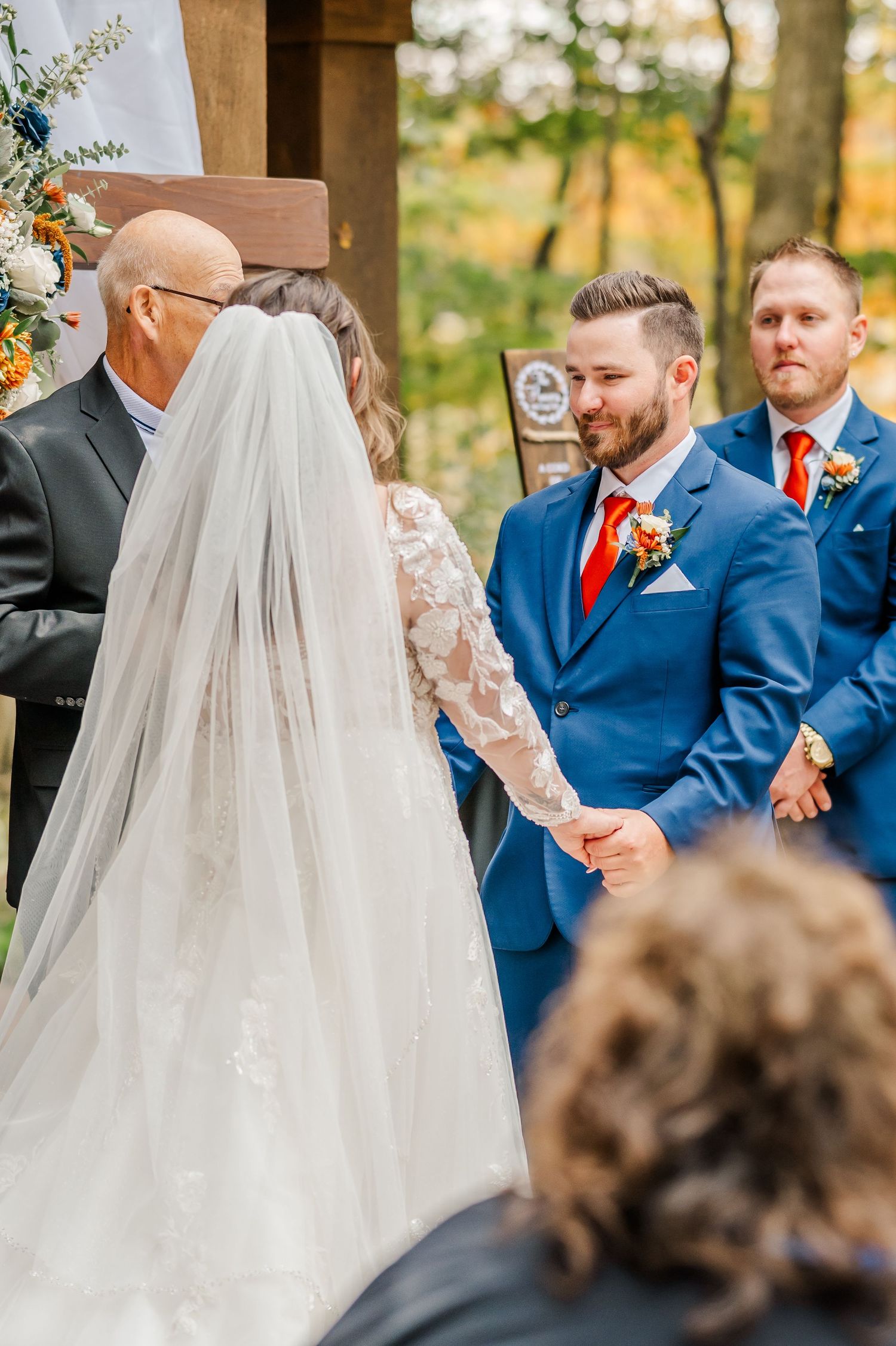 A series of outdoor wedding ceremony photos featuring elegant attire and autumn foliage in the background.