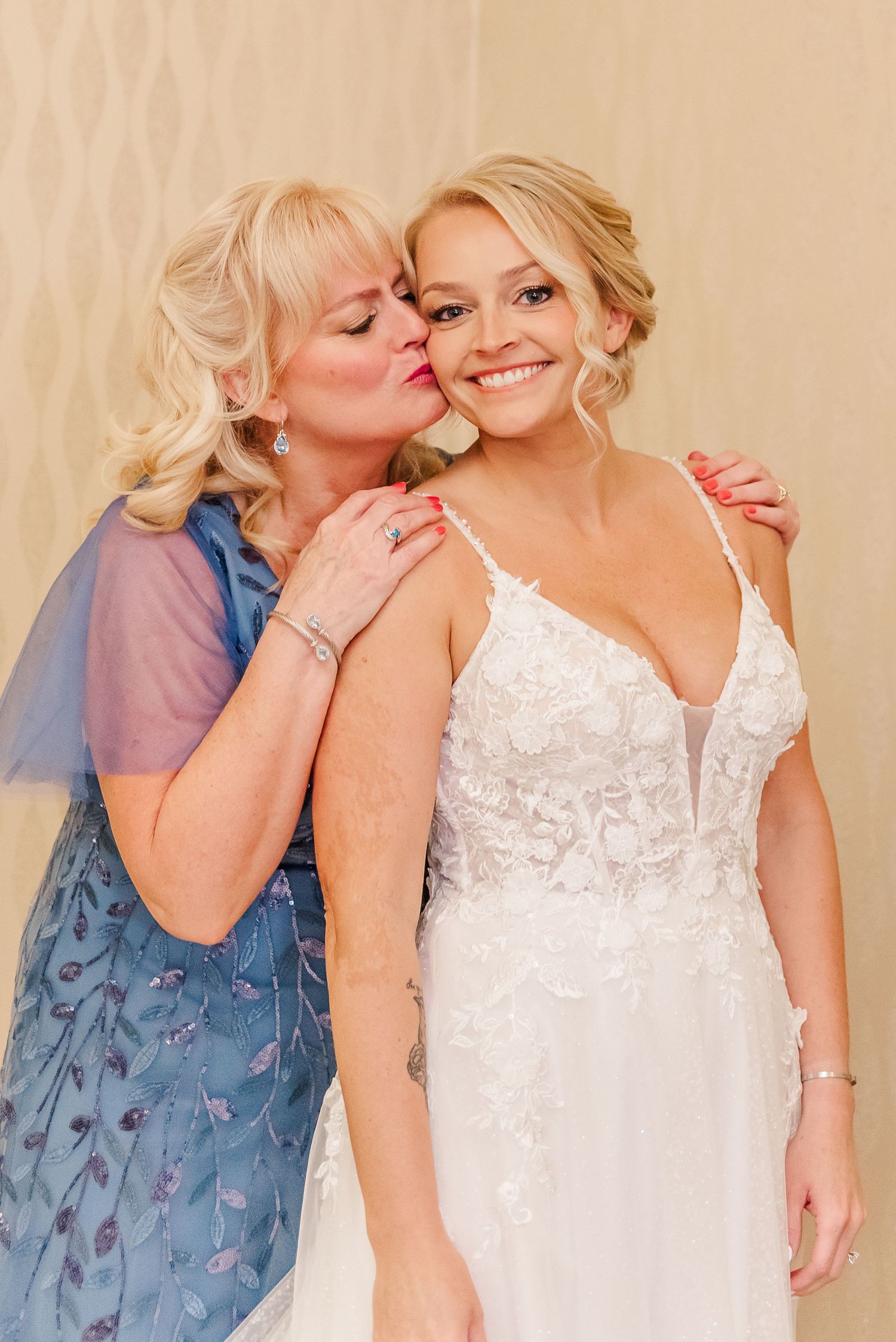 A tender moment captured in a series of four photos showing affectionate gestures between two people in white and blue attire.