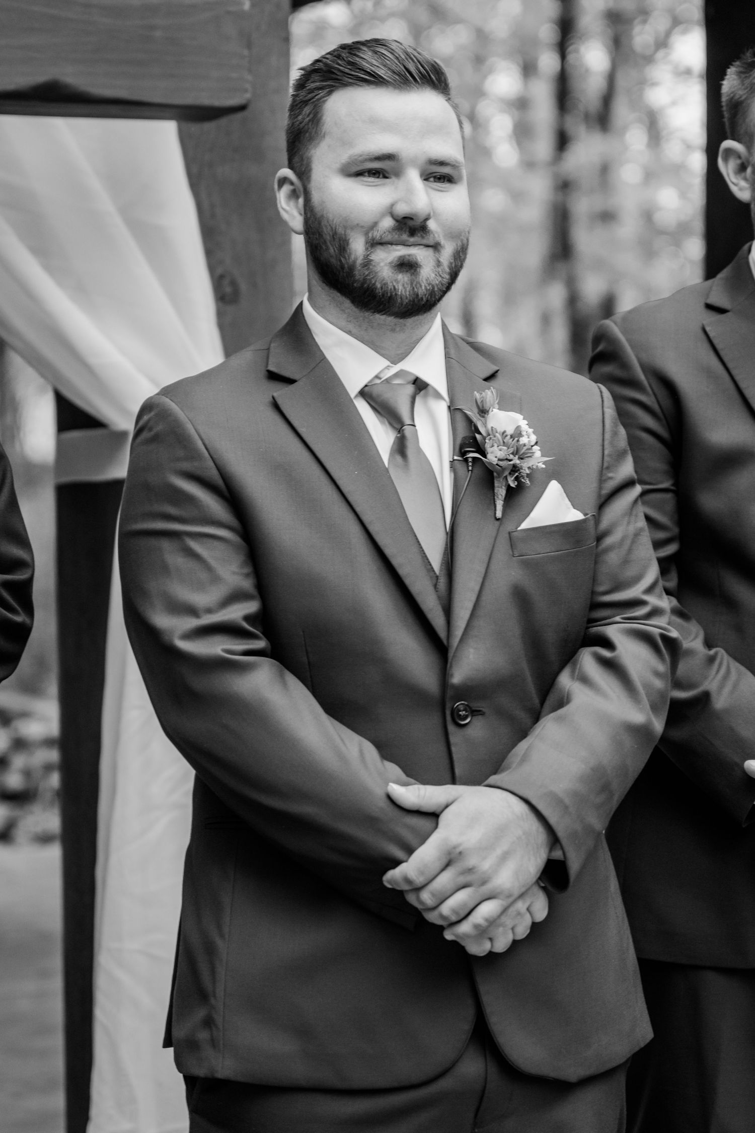 Black and white portrait series showing groomsmen in formal suits at an outdoor wedding.