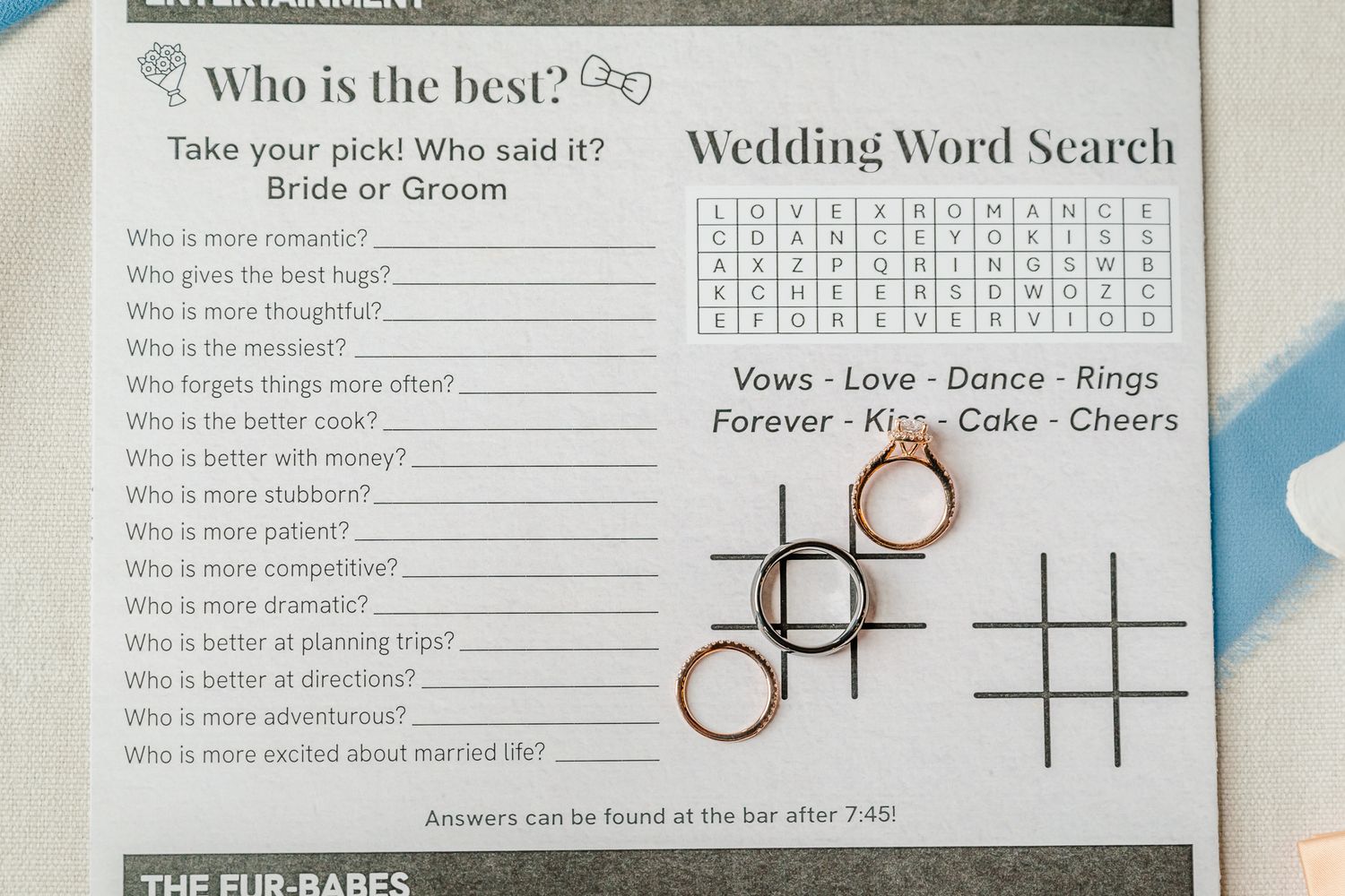 Wedding activity card featuring a Who is the Best bride or groom quiz and a Wedding Word Search with rings on top.