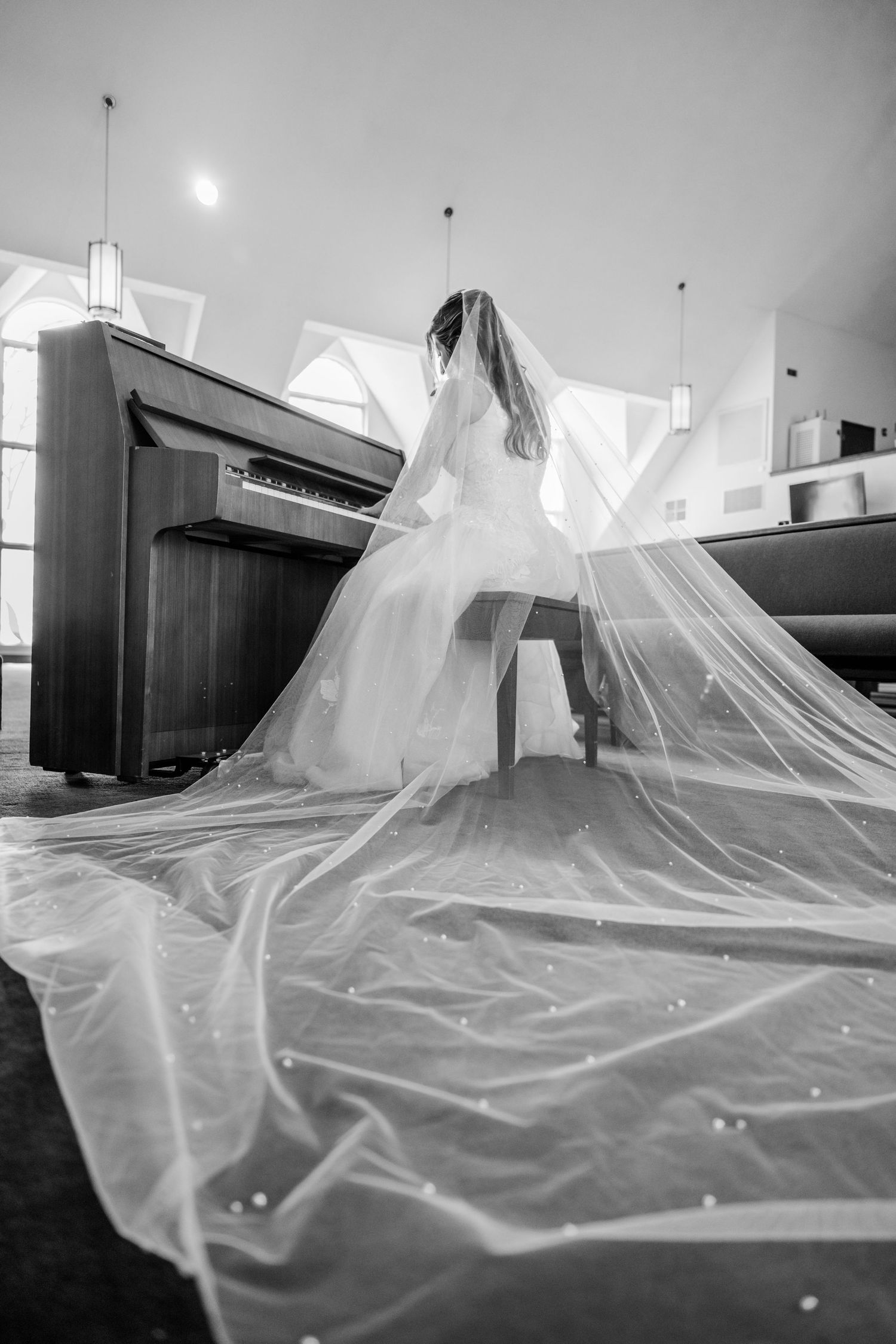 Ethereal white tulle veil floating in a black and white photo sequence creating a dreamy artistic effect.