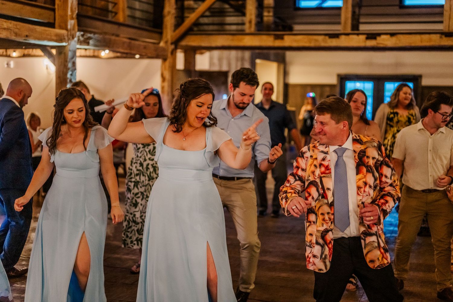 Wedding reception venue with wooden beams and warm lighting creating an intimate rustic atmosphere.