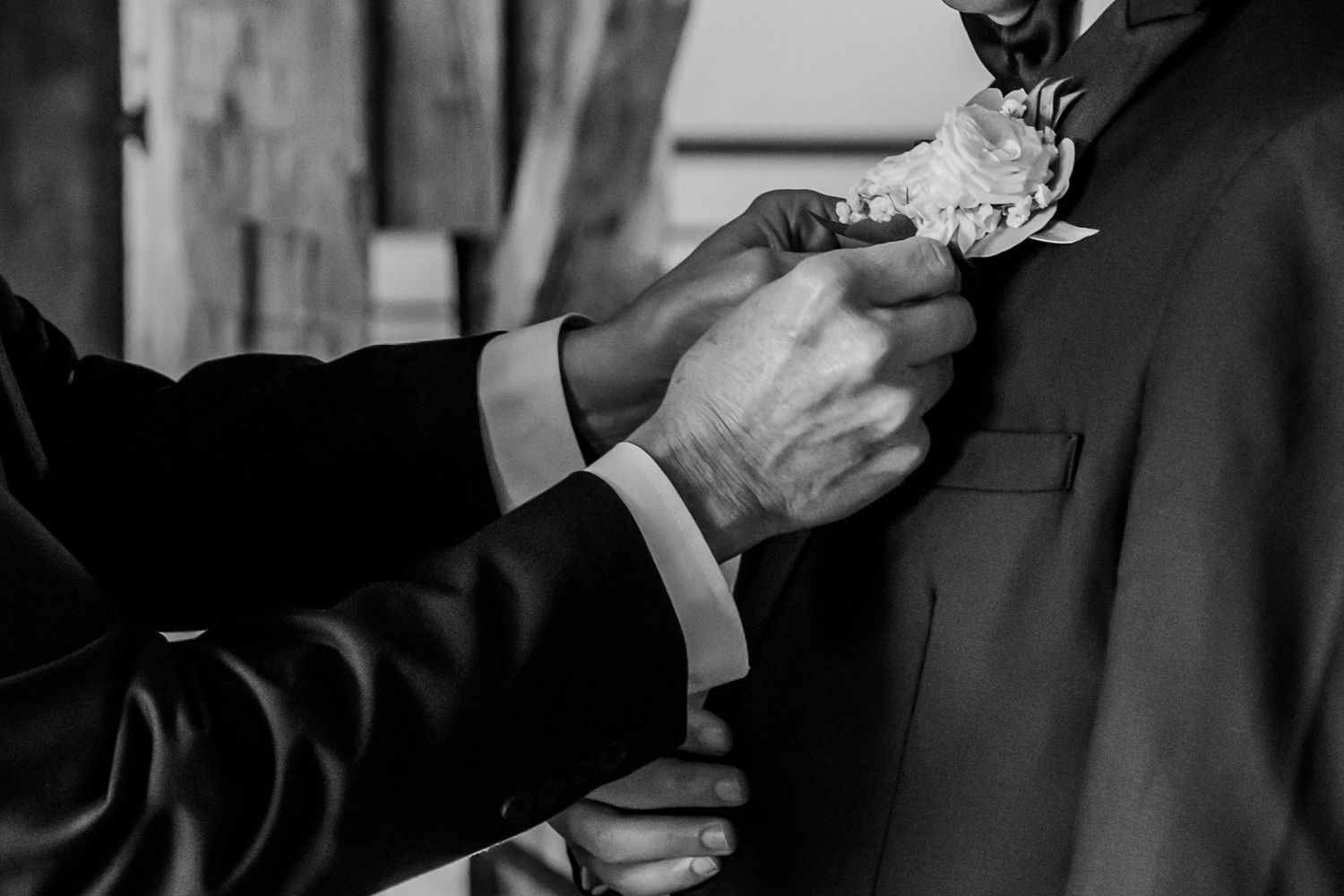 A series of black and white photos showing hands adjusting neckties and suit jackets in formal attire.
