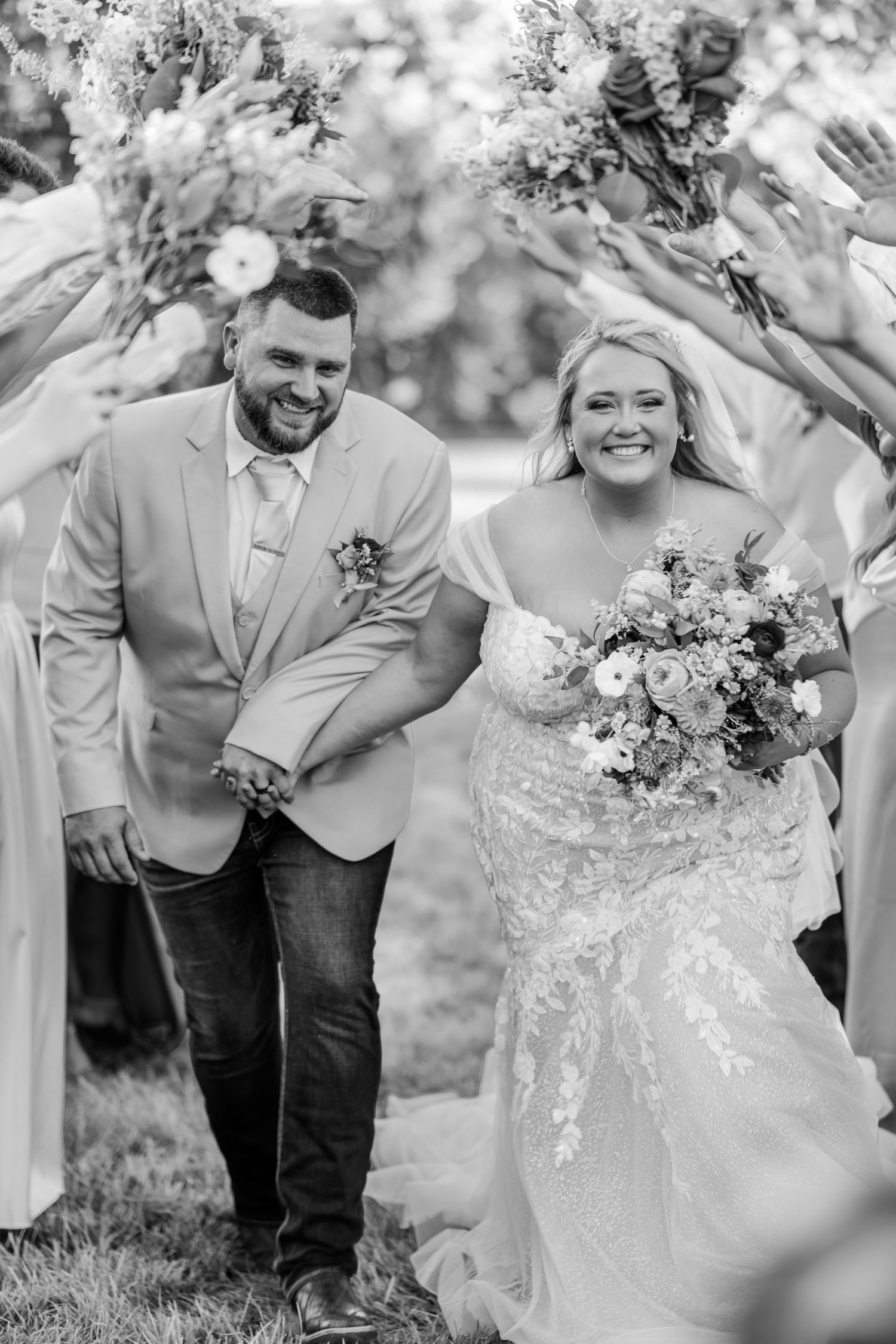 Black and white candid wedding photos showing joyful moments between a couple during their celebration.