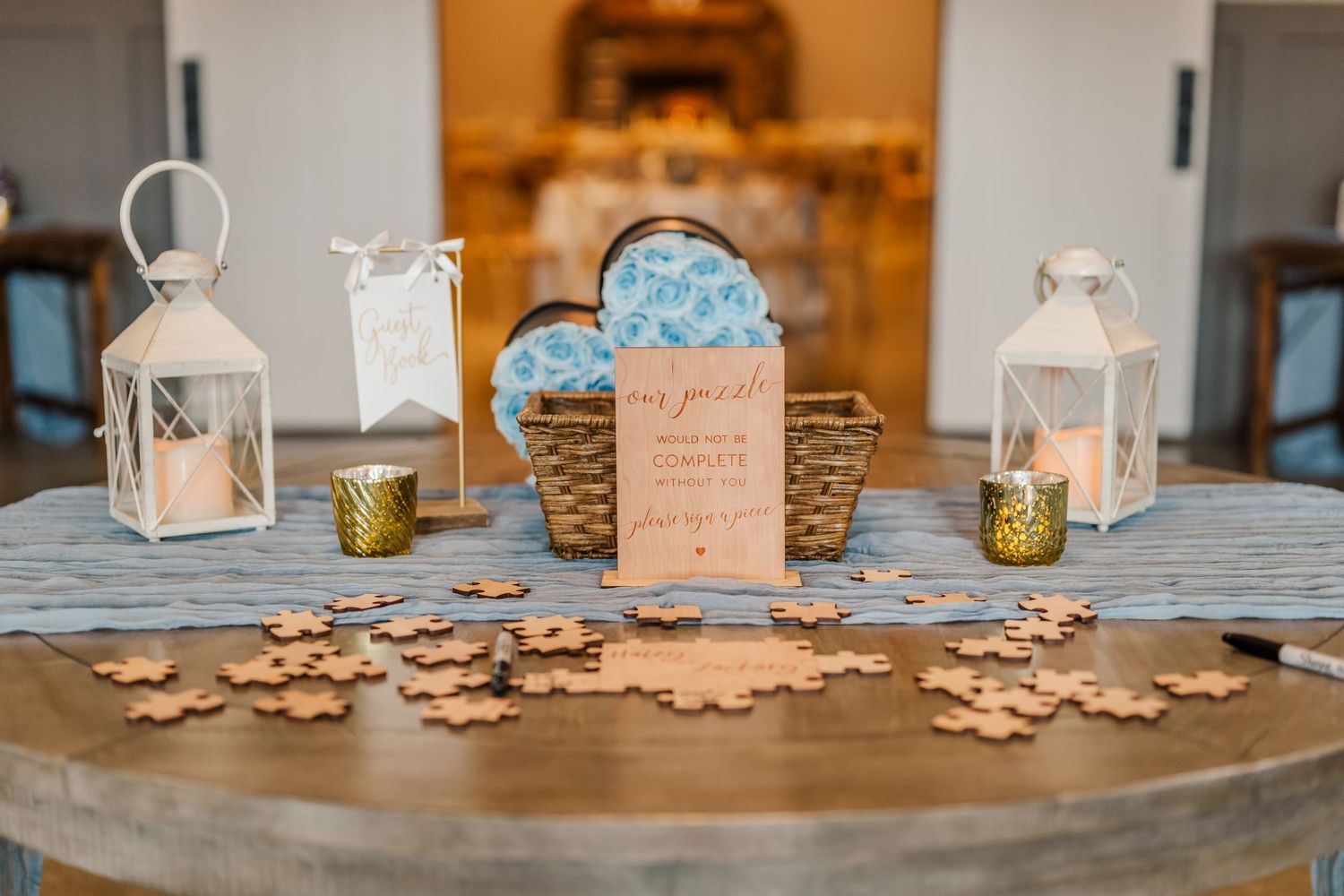 Rustic wedding reception table settings with white lanterns and soft lighting creating a warm ambiance.