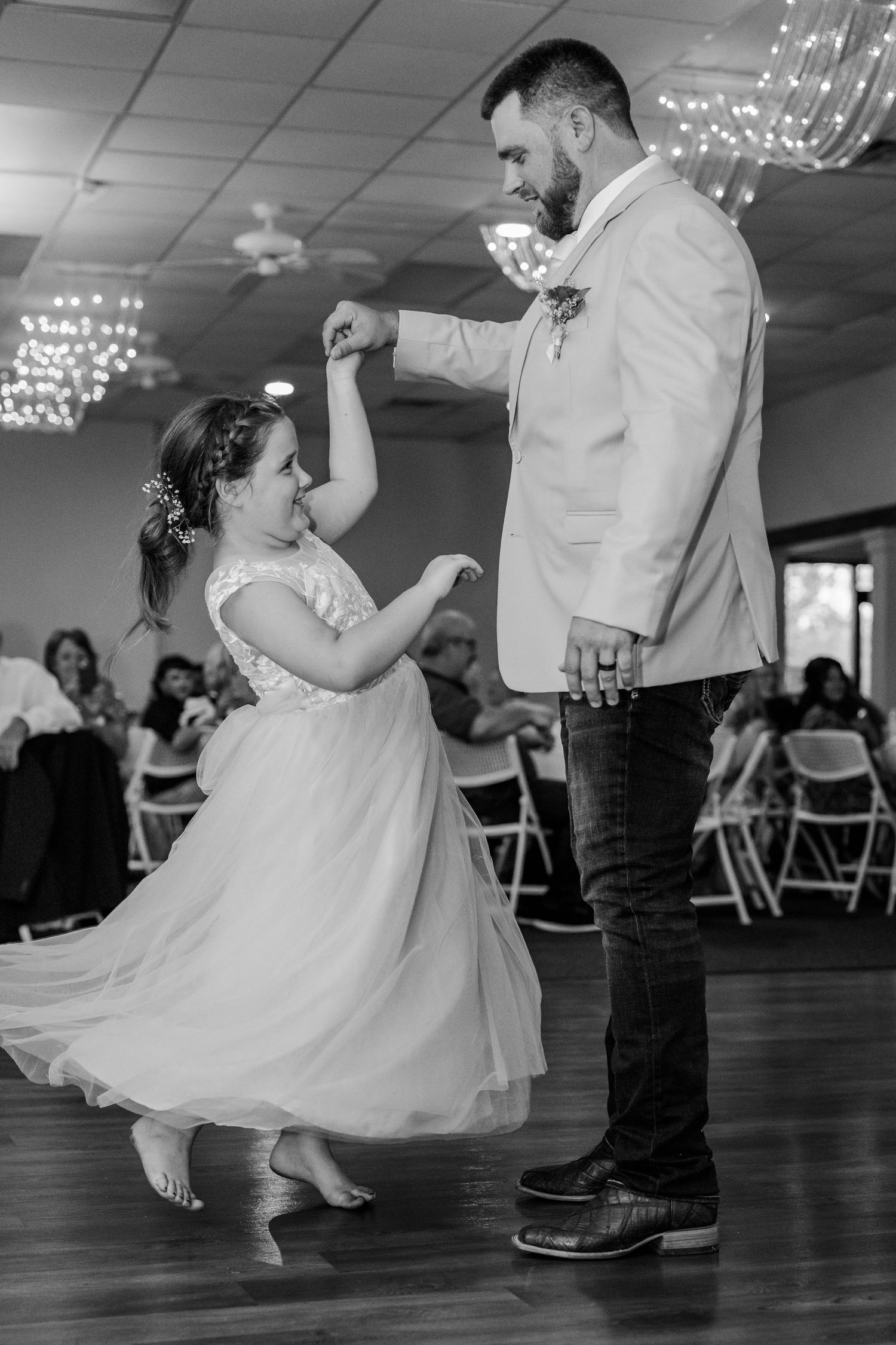 Black and white photos showing dancers in formal attire twirling on a dance floor.
