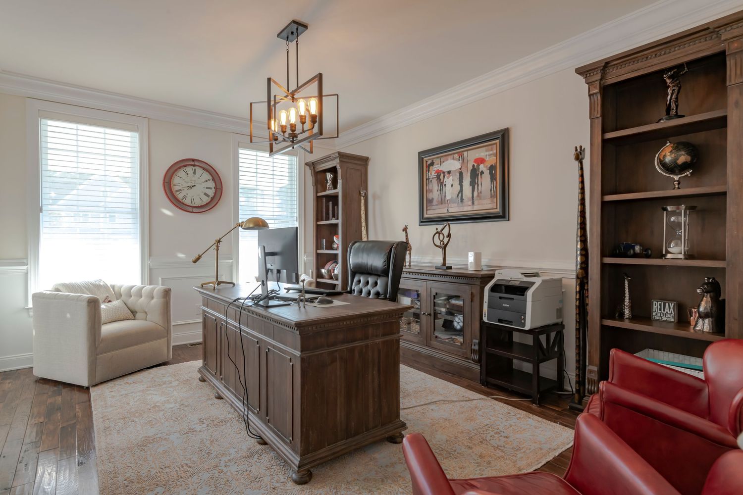 Elegant home office with dark wood desk, created by the best real estate photographer on South Shore