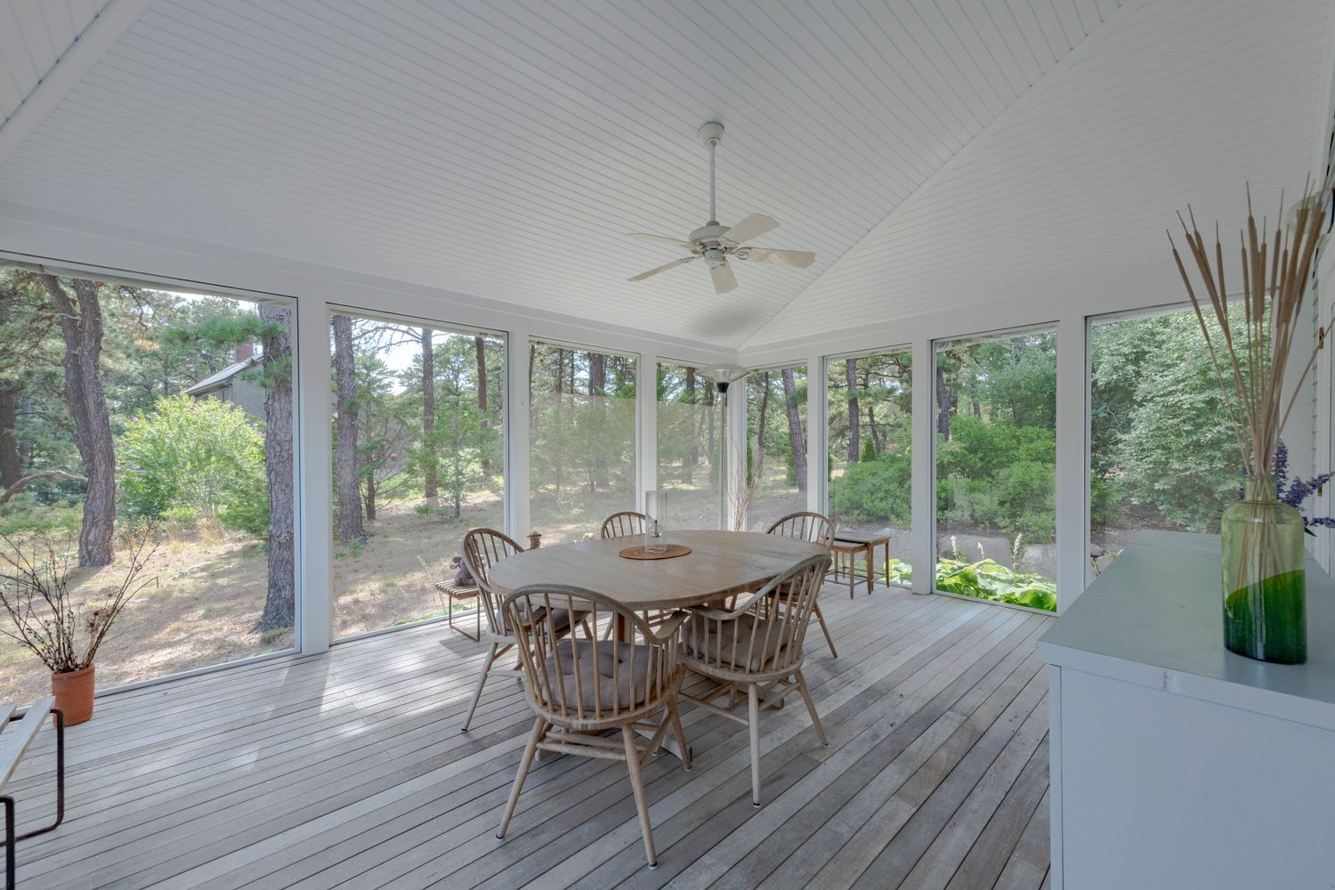 A bright screened porch by Cape Cod preferred Real estate photographer