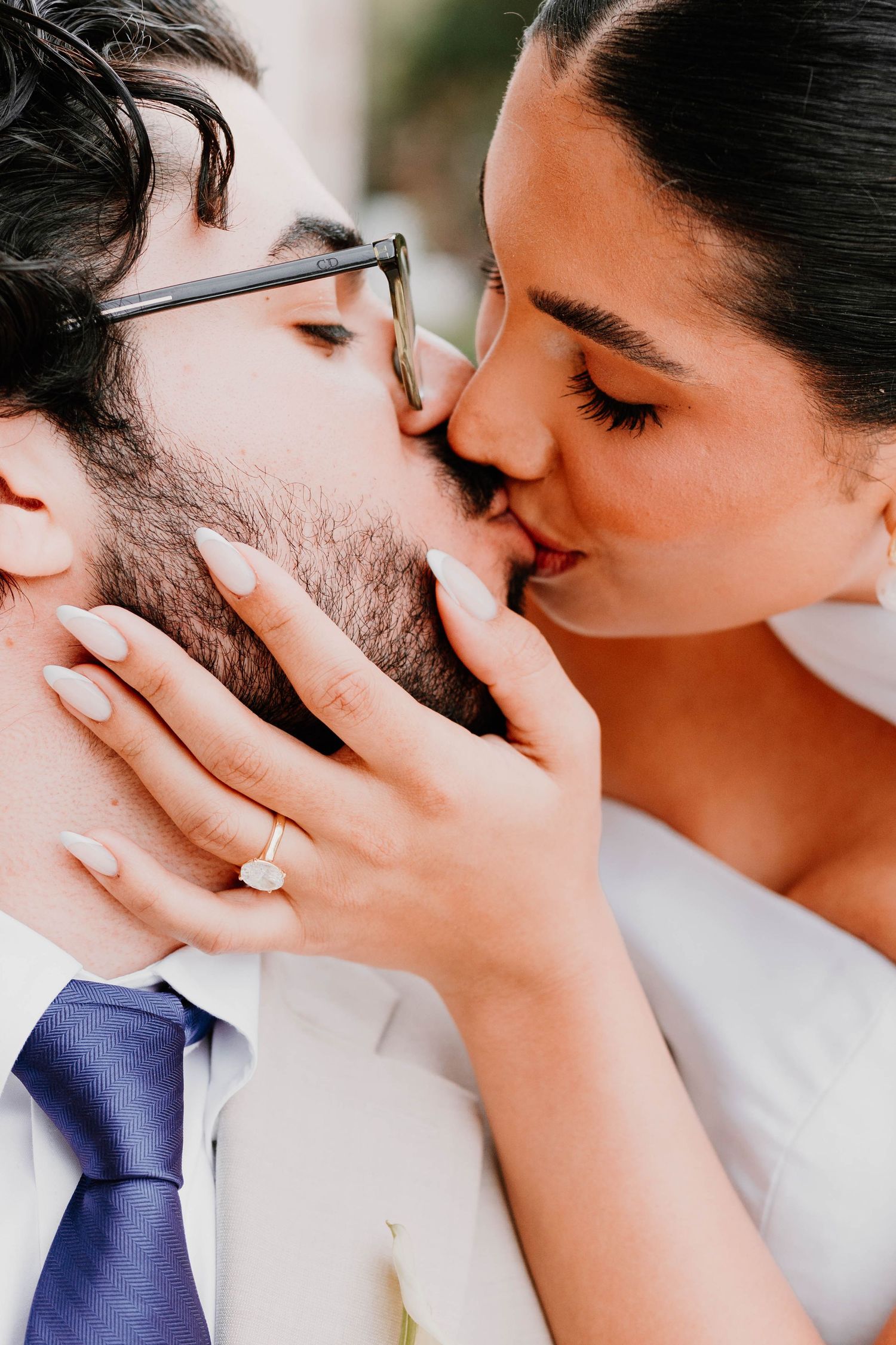 Intimate wedding portrait showing tender moment between newlyweds.