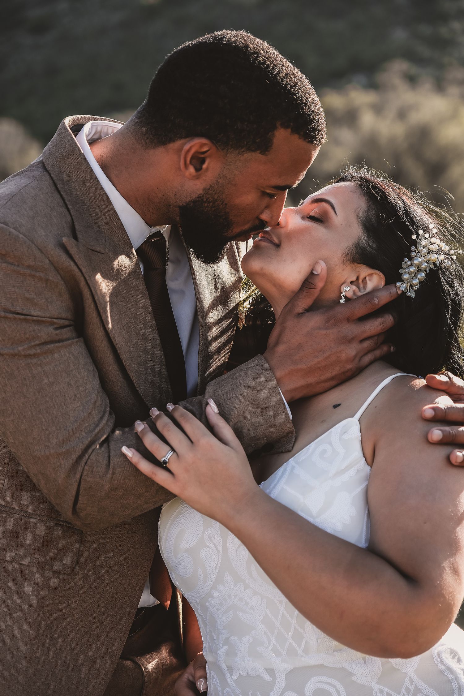 Intimate wedding portrait of couple sharing romantic moment.
