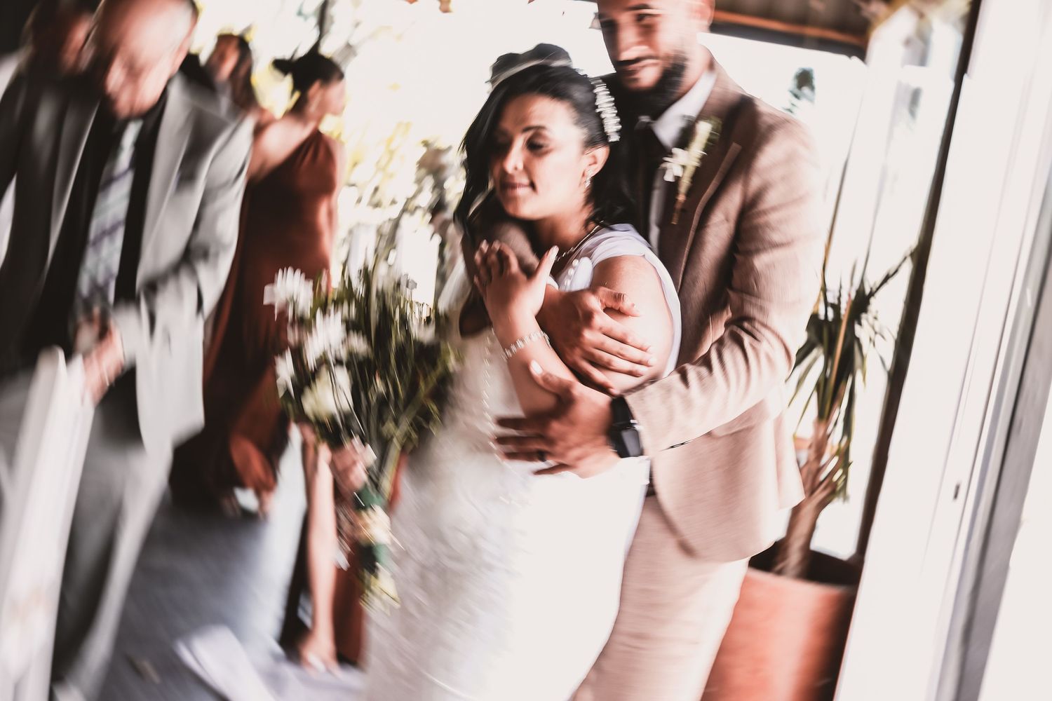 Artistic motion blur capture of wedding couple dancing at reception.