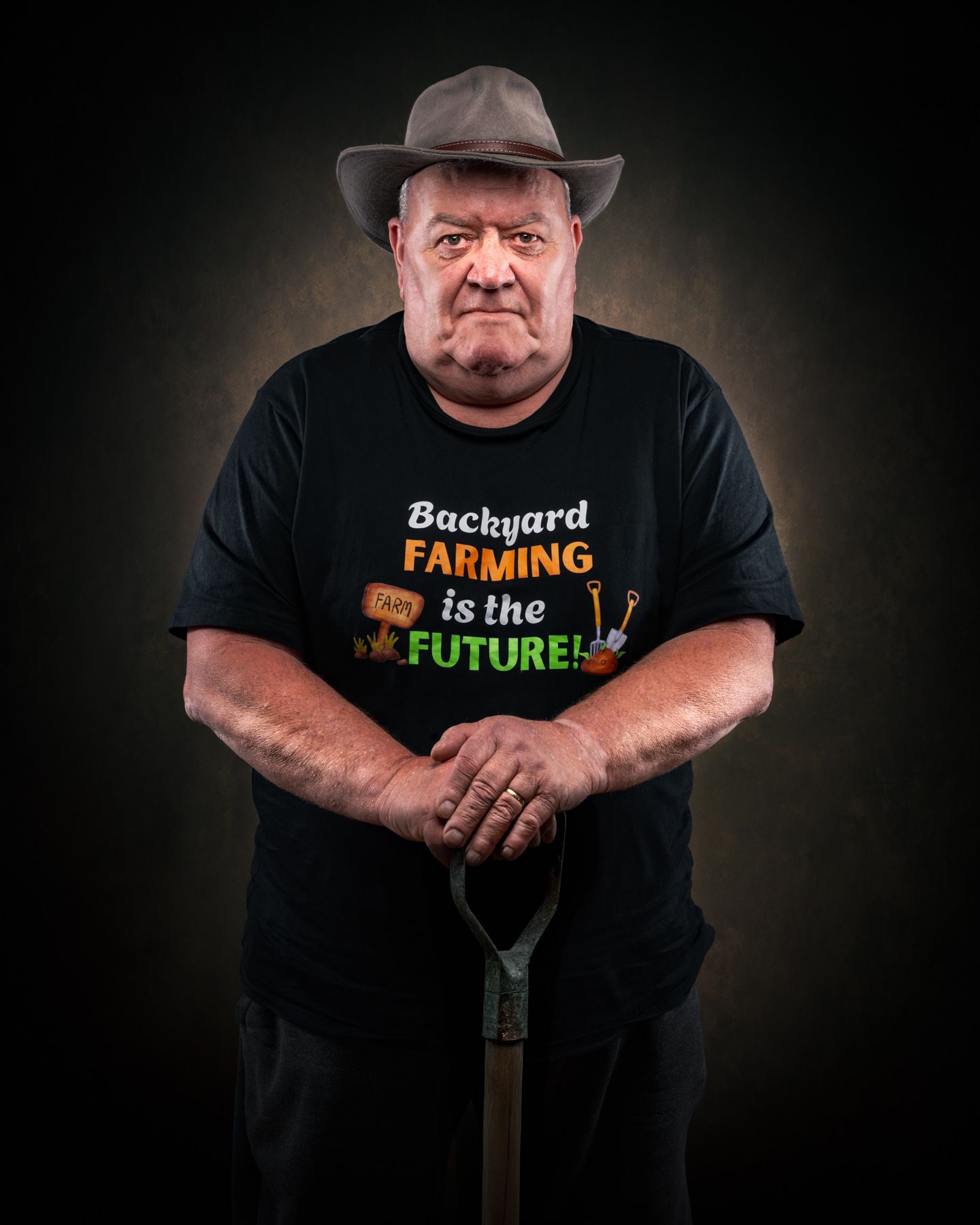 A series of dramatic studio portraits showing a person in black t-shirts with farming-themed messages against dark backgrounds.