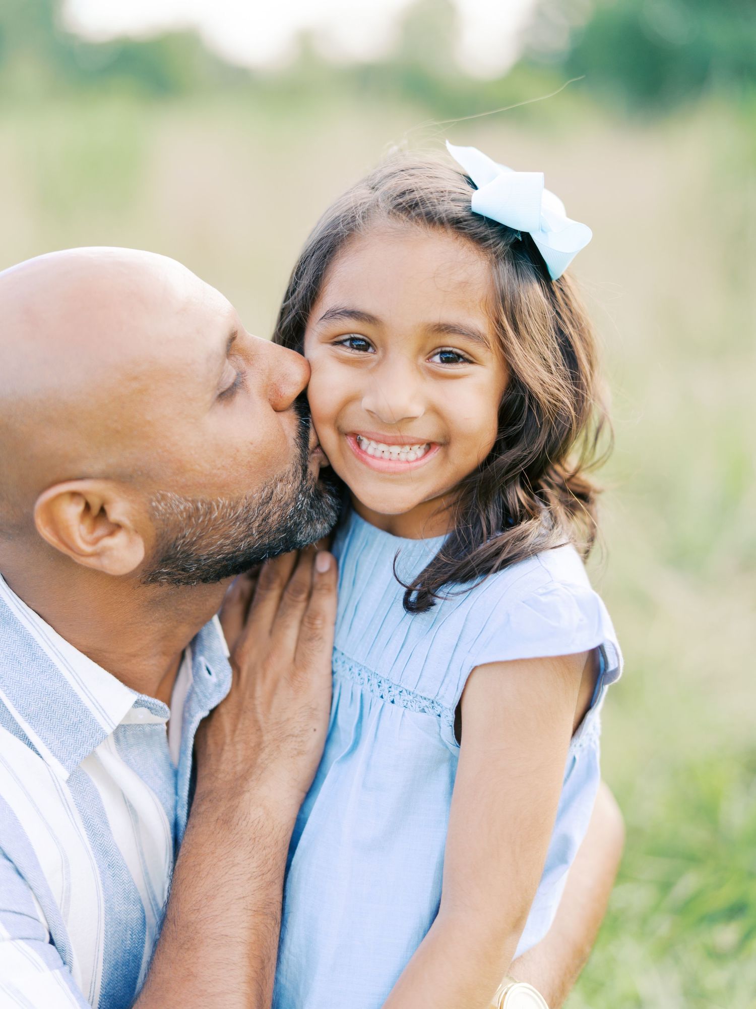 A heartwarming candid sequence of tender family moments captured outdoors in soft natural lighting.