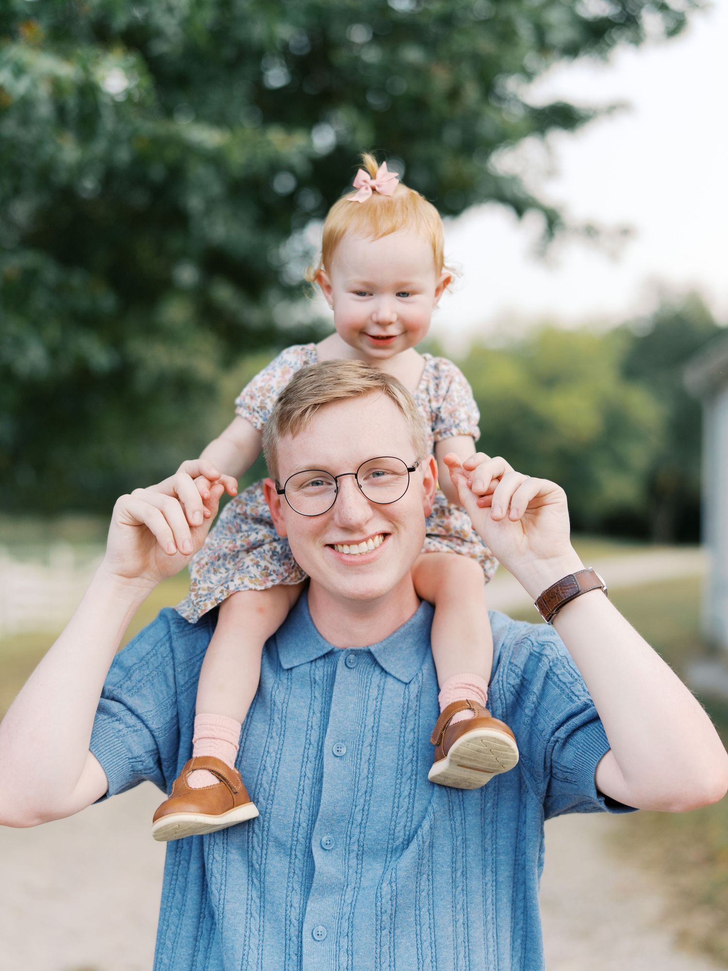 A series of playful expressions and poses in a casual outdoor photo session wearing a blue shirt and glasses.