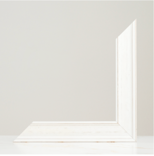 Minimalist white room corner with light wood floor and clean white walls in a bright, airy interior space.