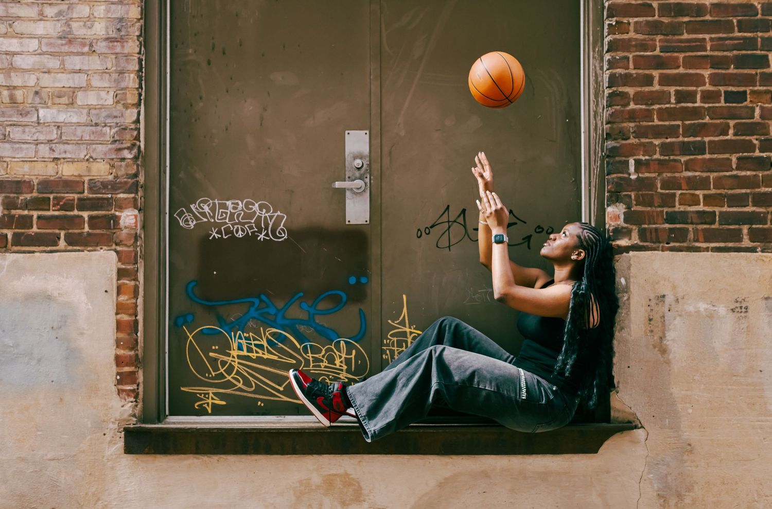 Portrait of a girl holding a basketball during a lifestyle photoshoot in Stafford, VA.