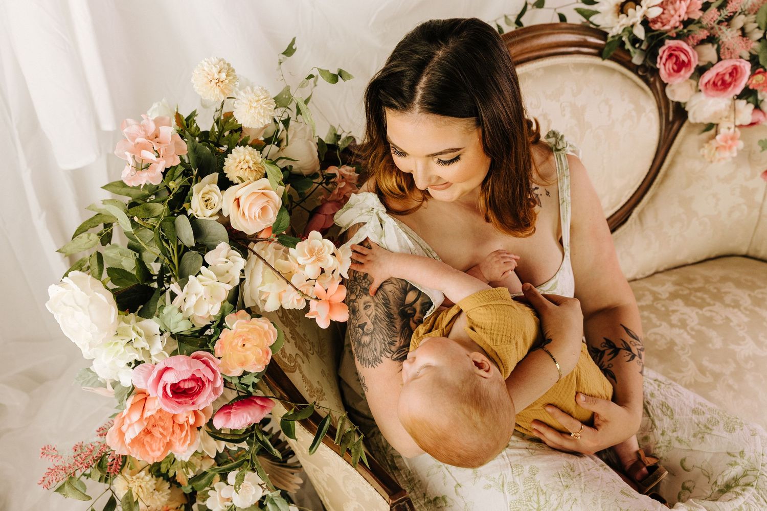 Elegant boudoir scene with soft pink roses and vintage antique furniture in dreamy natural lighting.