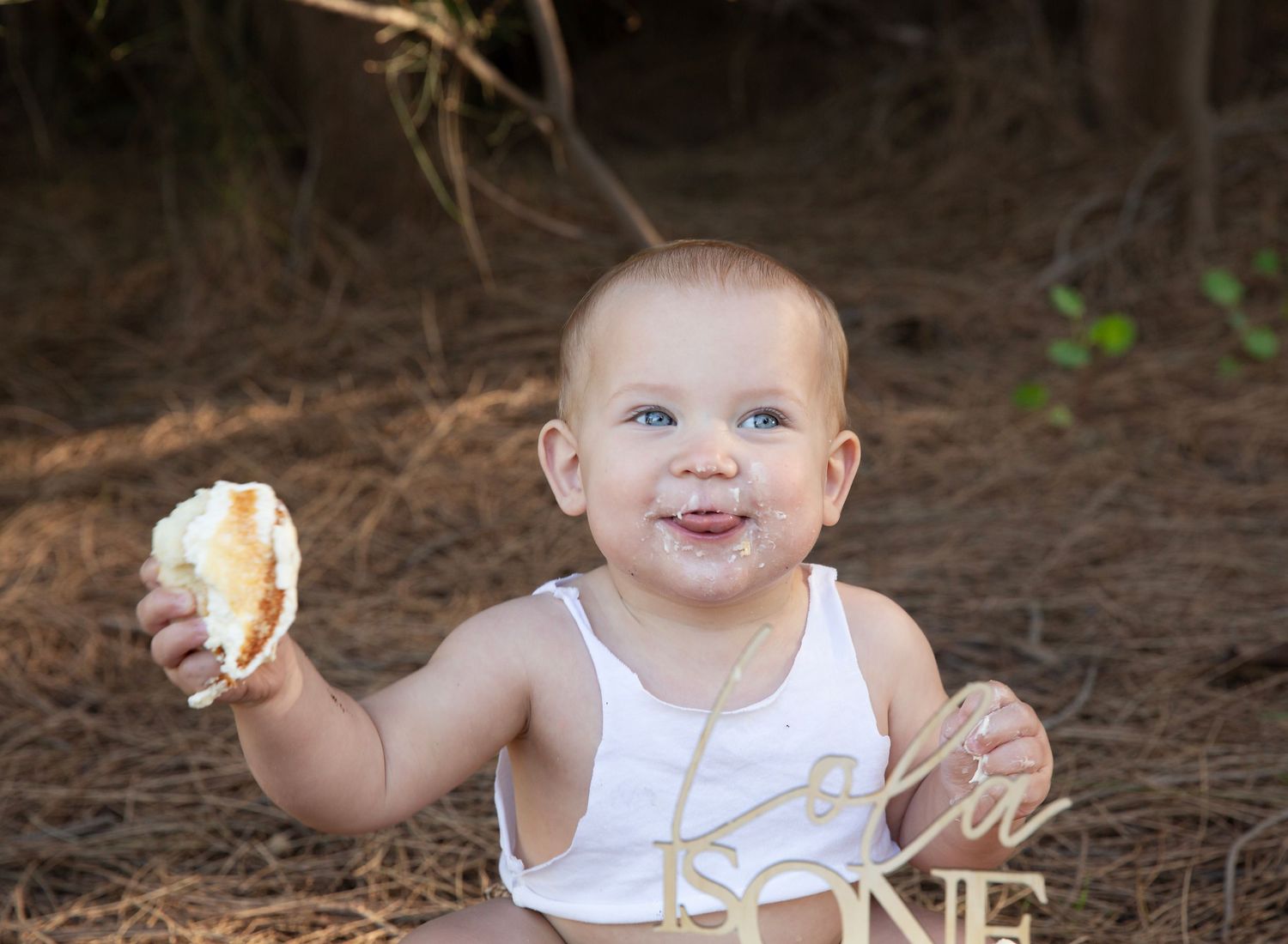 Outdoor cake smash session, cheeky face baby. Taken at the Paddocks Reserve, Adelaide.