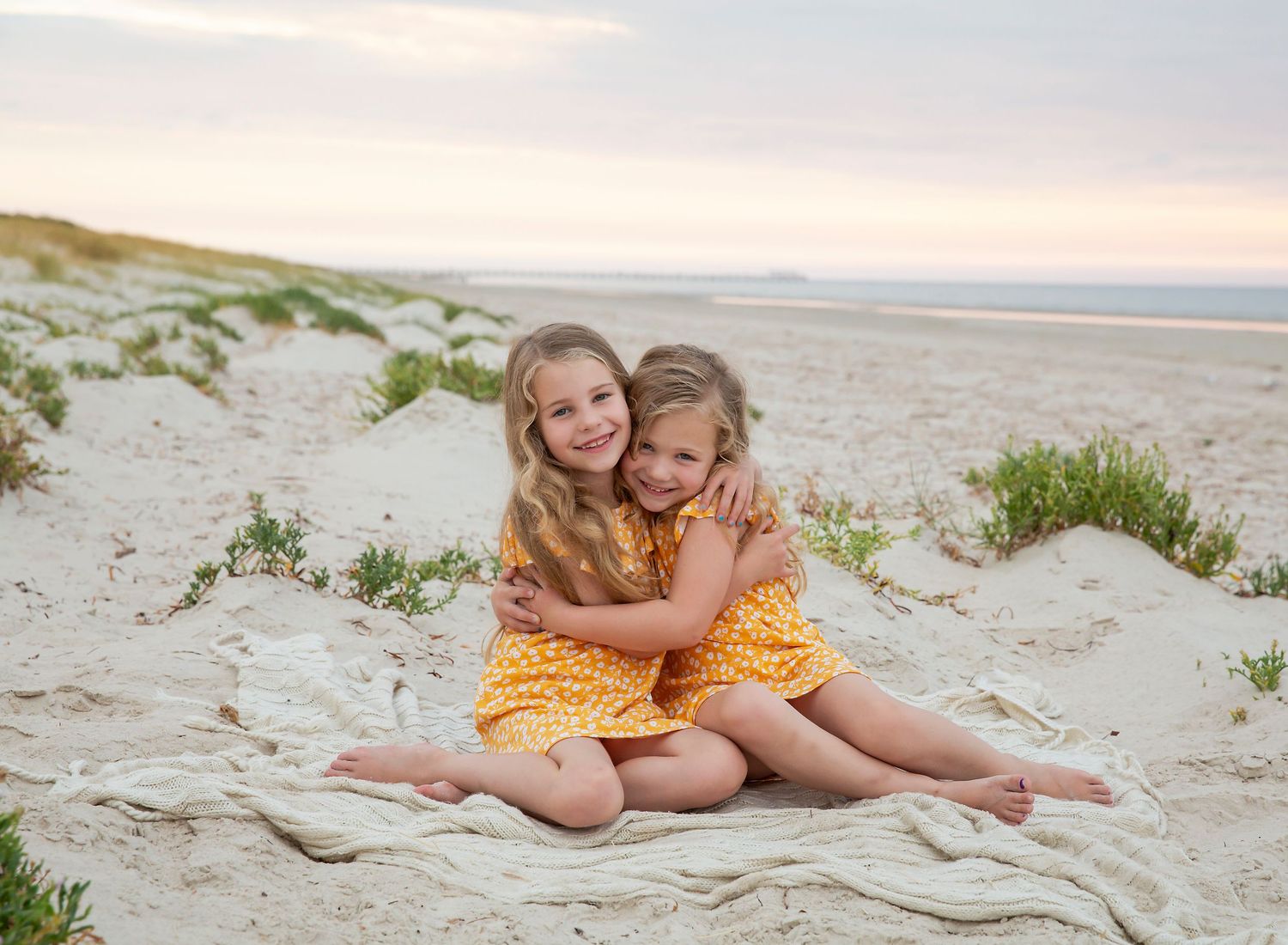 Two sisters hugging in family photo session in Semaphore SA.