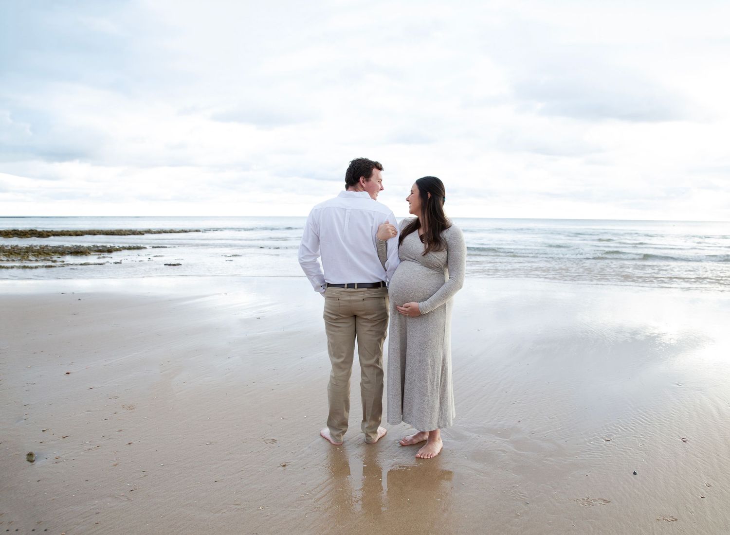 Pregnant mum posing with husband in beach maternity photo session in Port Noarlunga SA.