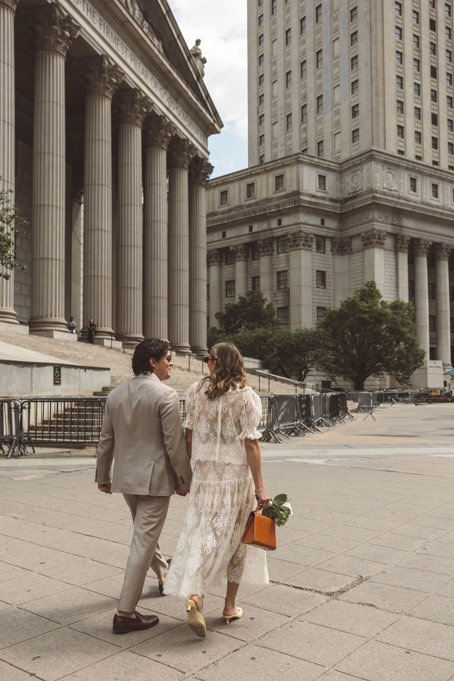 Couple walking around New York during their bridal portraits