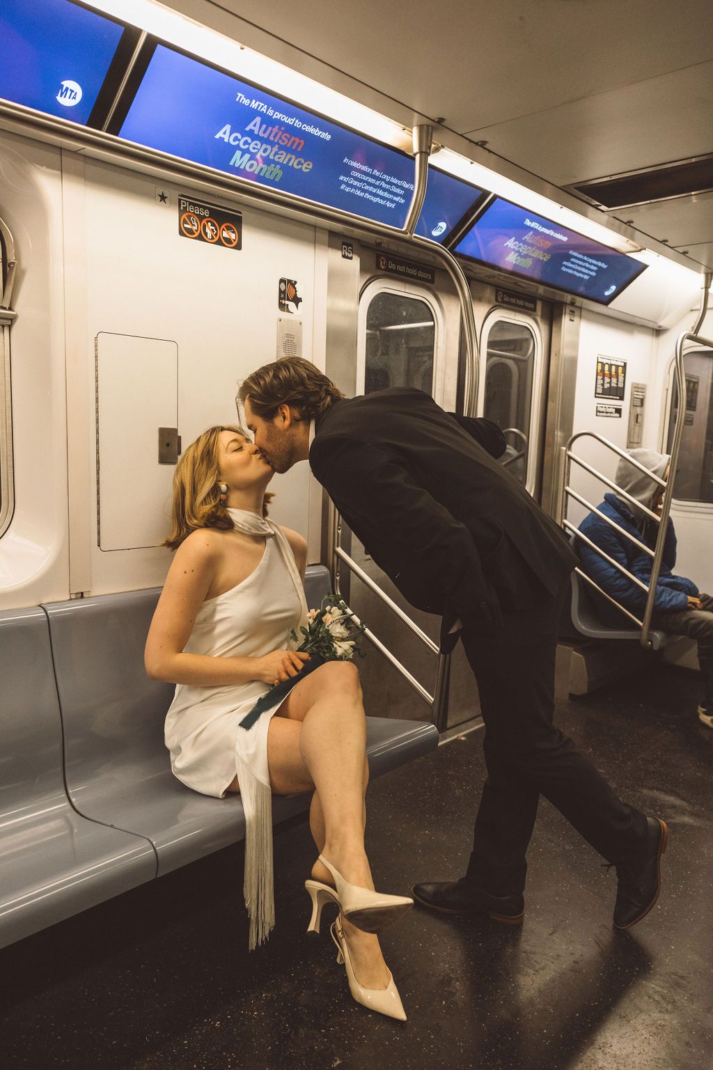 cute portrait of the newlyweds kissing in the subway