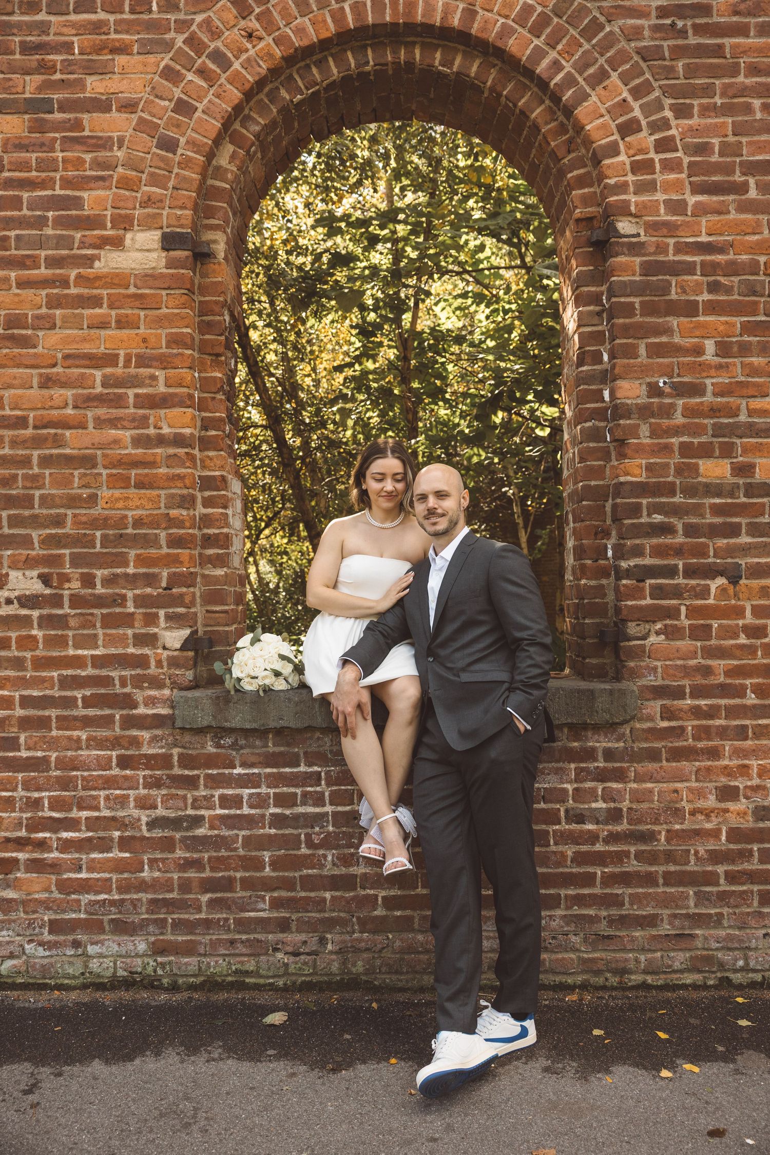 Couple smiling at the camera during their photoshoot