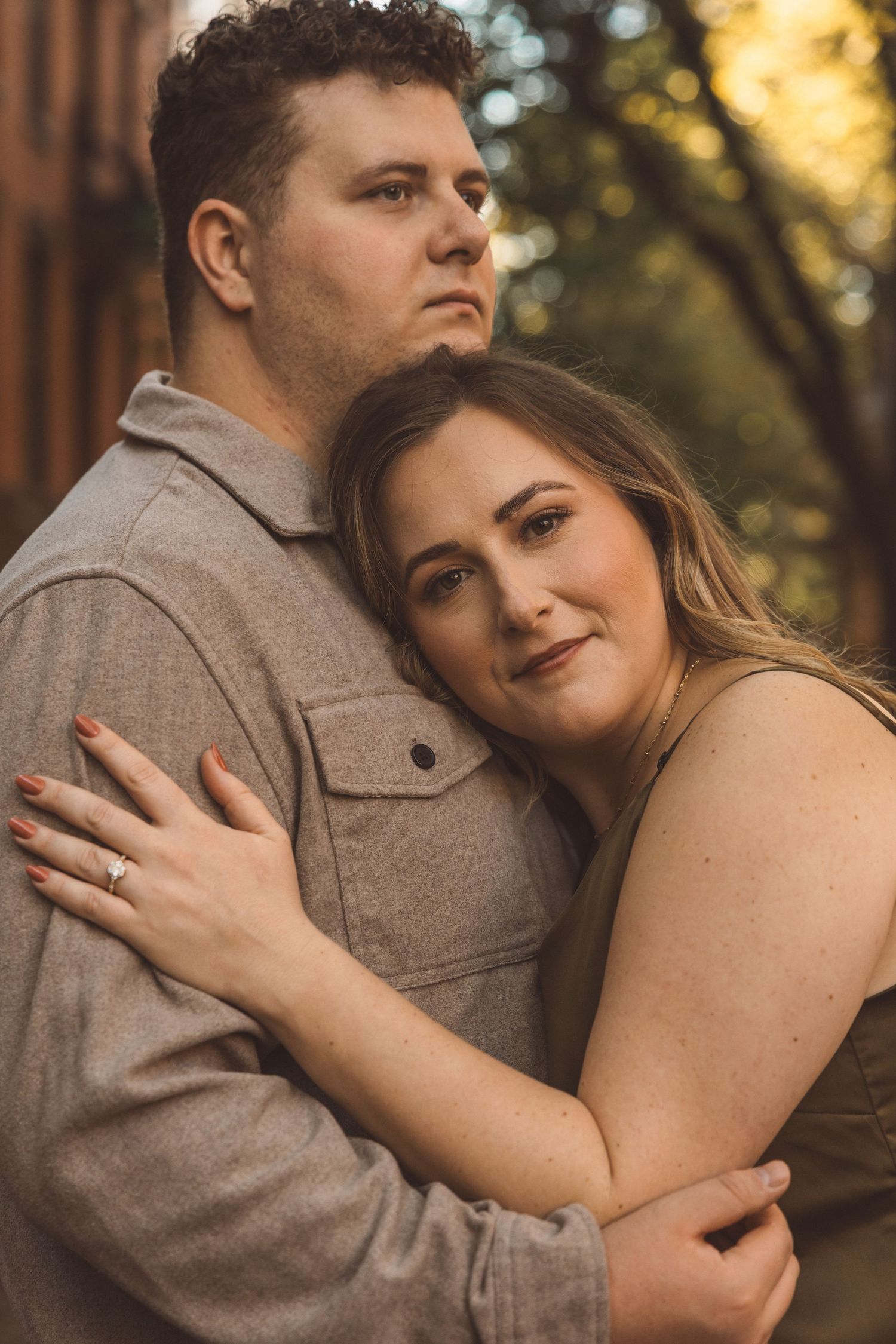 cute picture of the newly engaged couple hugging