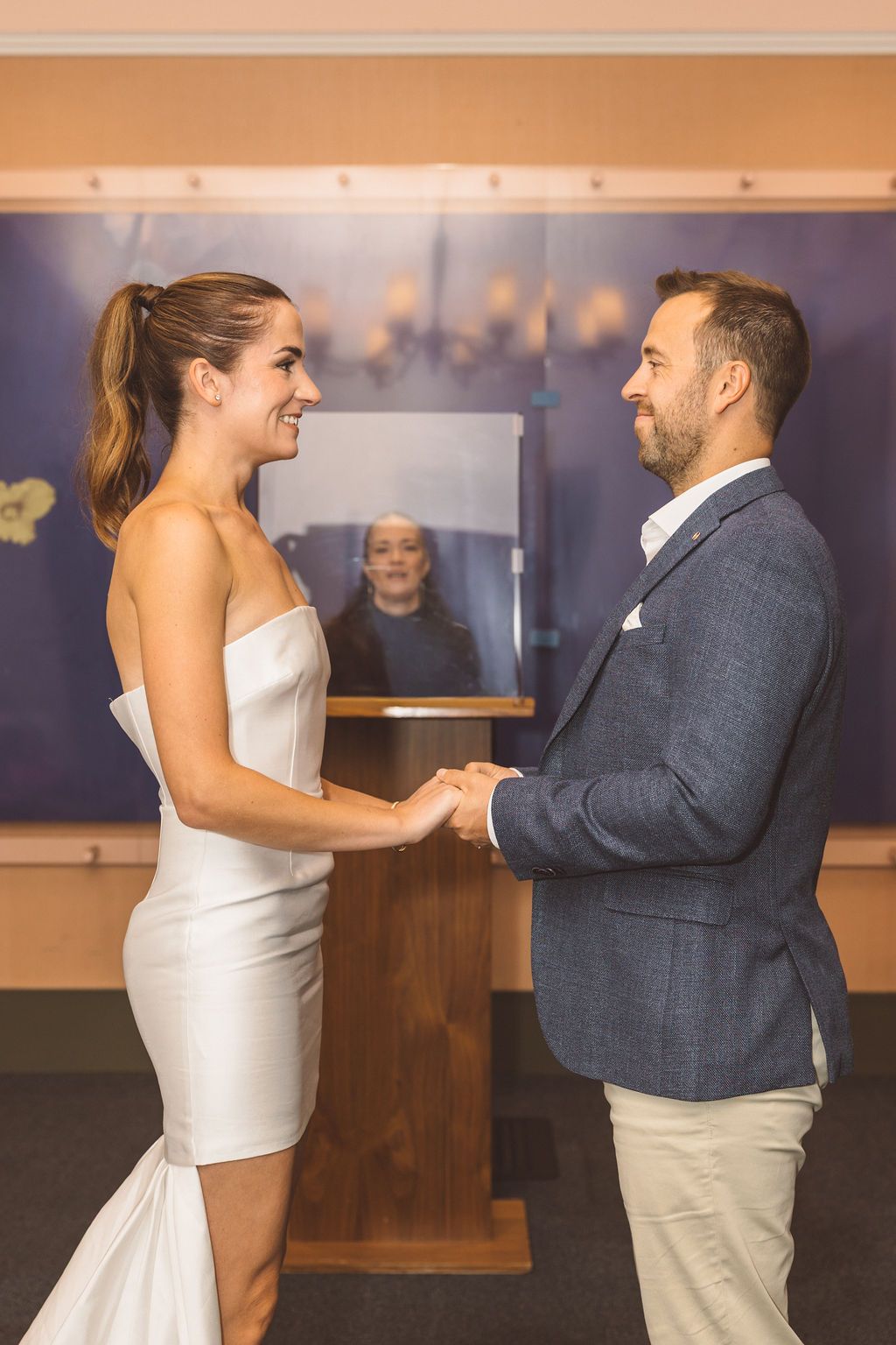 cute picture of the bride and groom holding hands during their NYC intimate ceremony