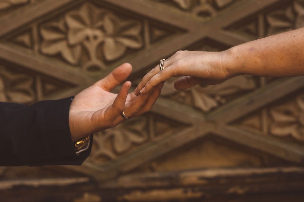 cute picture of the newlyweds holding hands