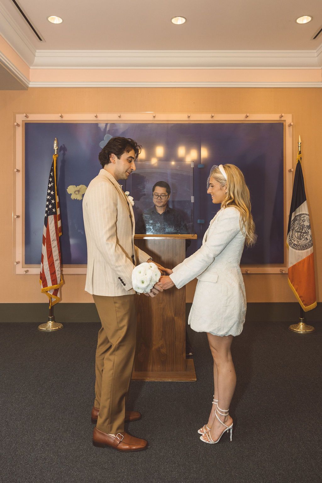 bride and groom holding hands during their ceremony
