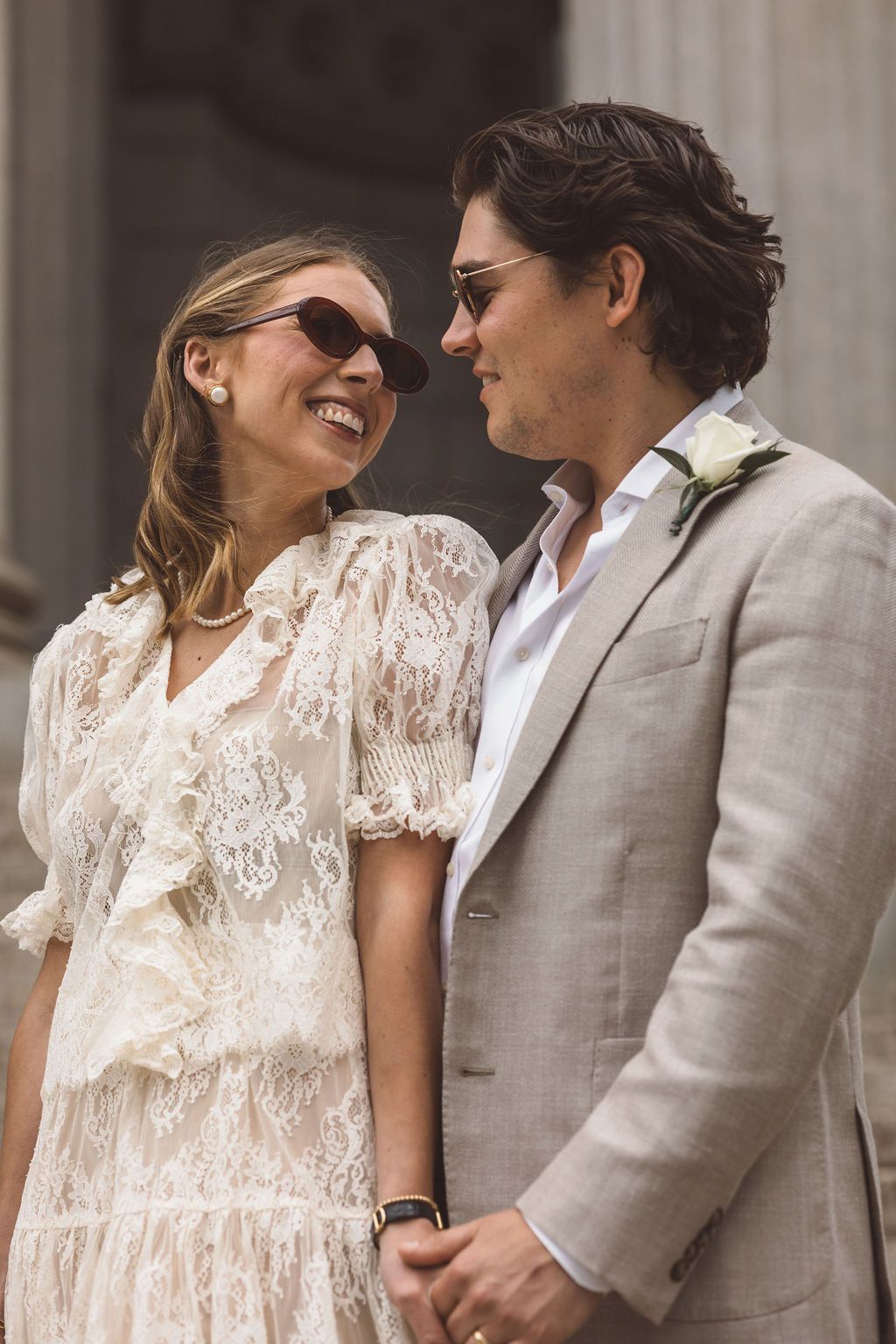 couple smiling at each other during their session