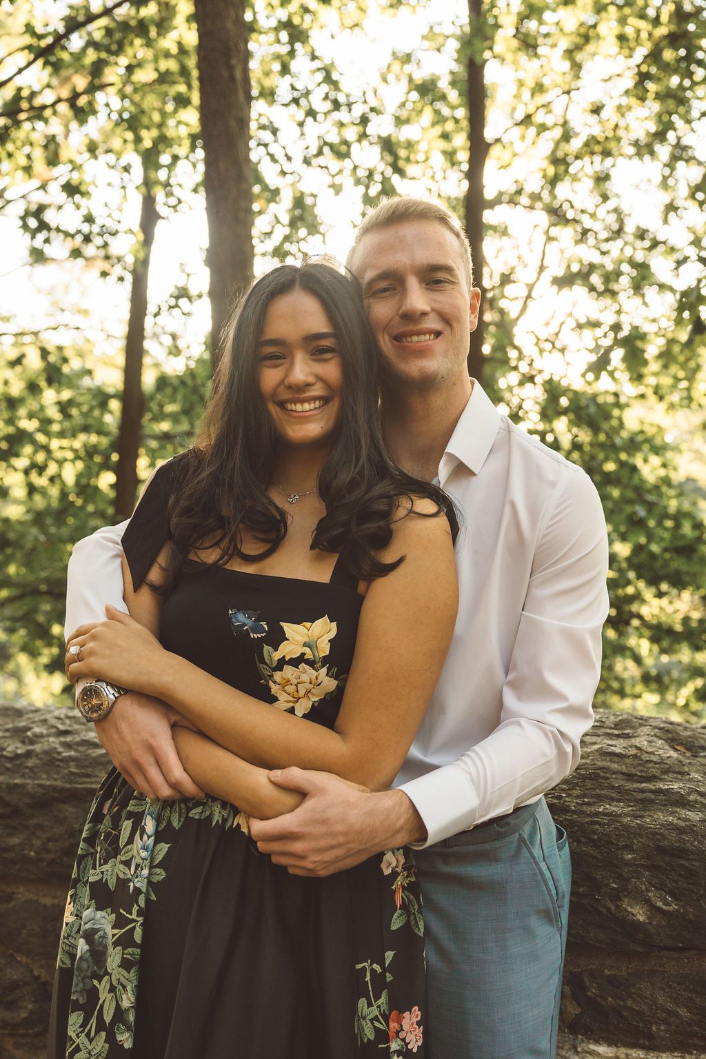 couple smiling at the camera during their session