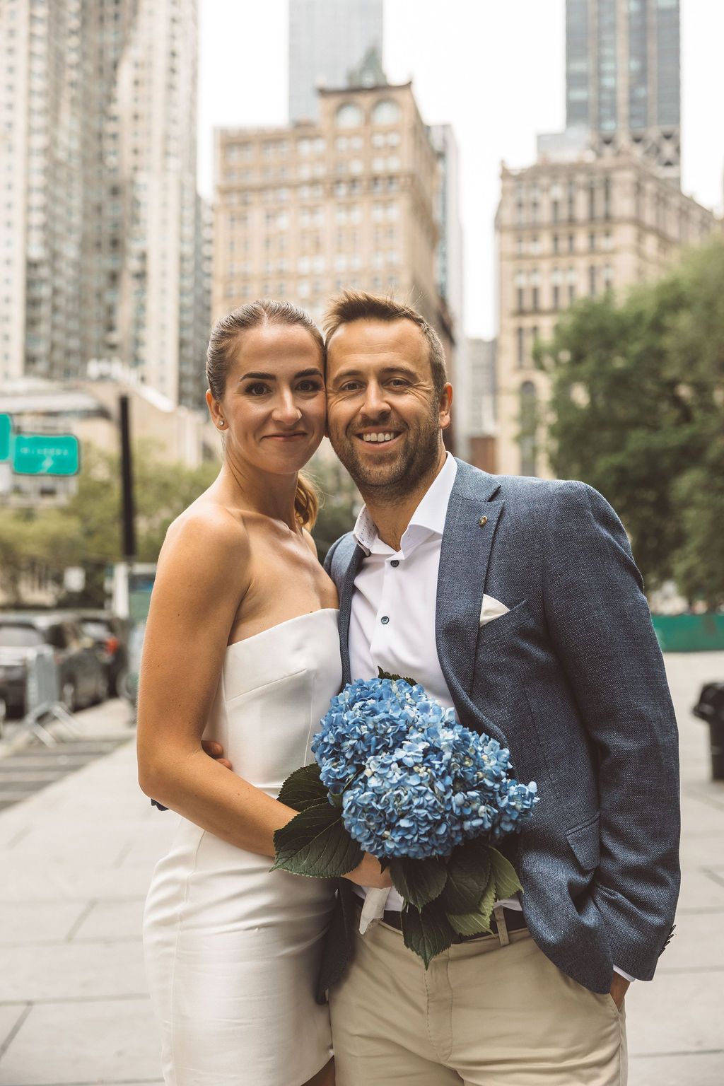 newlyweds smiling at the camera during their bridal session
