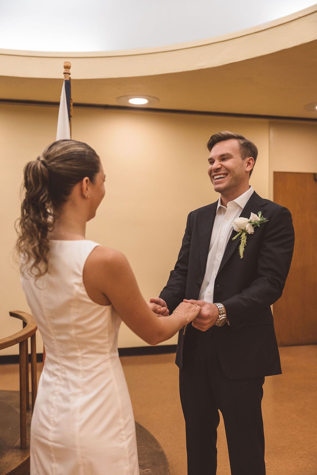 bride and groom holding hands during their ceremony
