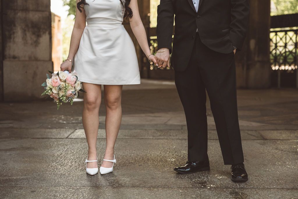 cute picture of the bride and groom holding hands