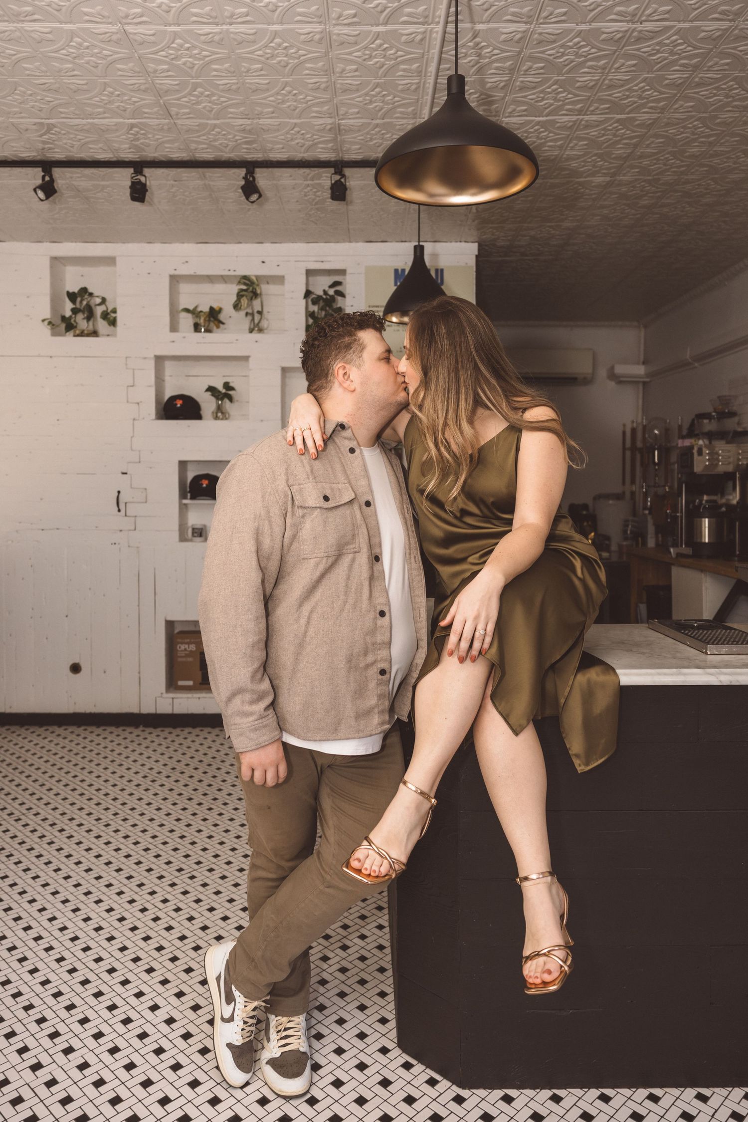 Picture of the newly engaged, couple kissing