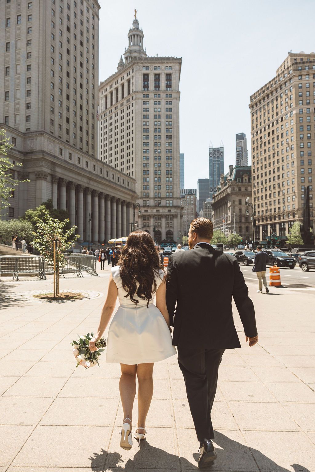 couple walking around NYC after their elopement ceremony