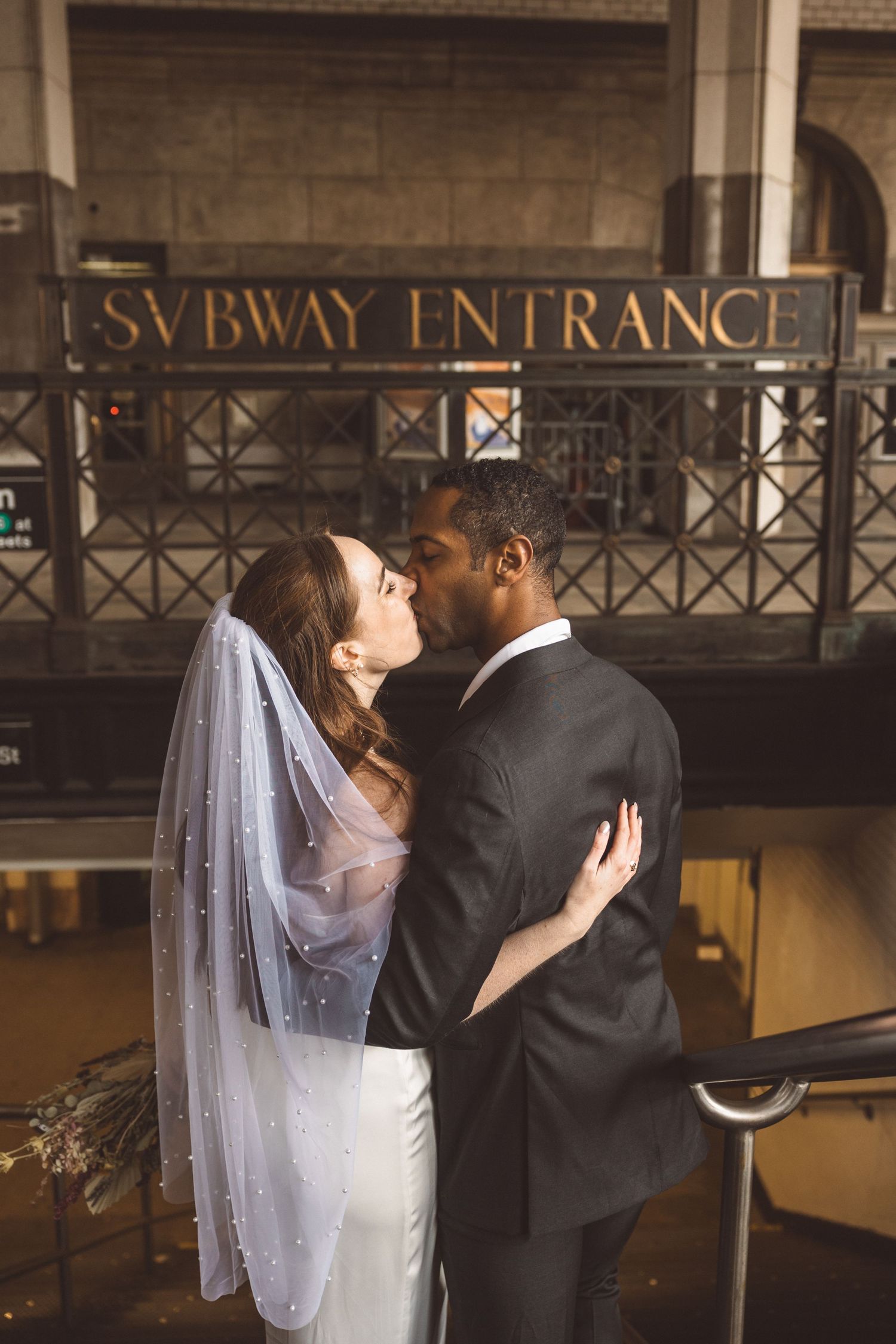 Portrait of the bride and groom, kissing