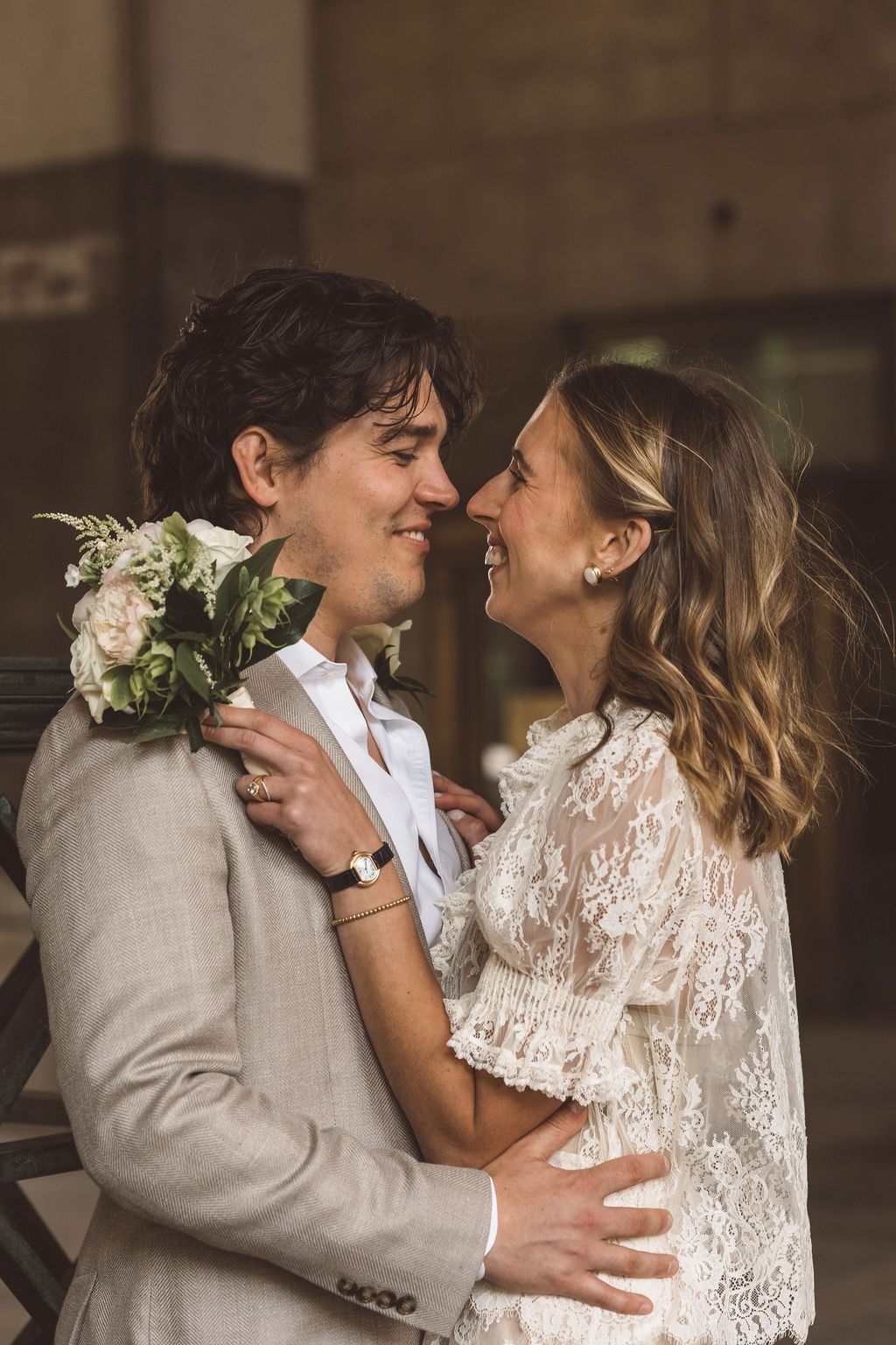 couple smiling at each other during their photoshoot