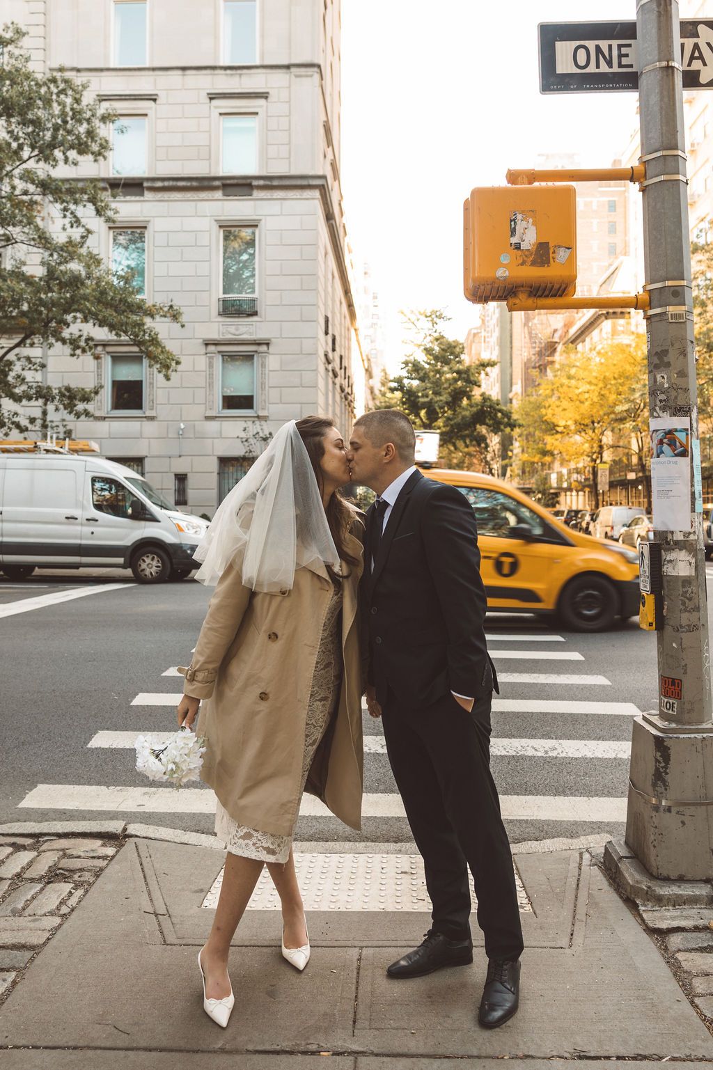 groom kissing the bride on the cheek