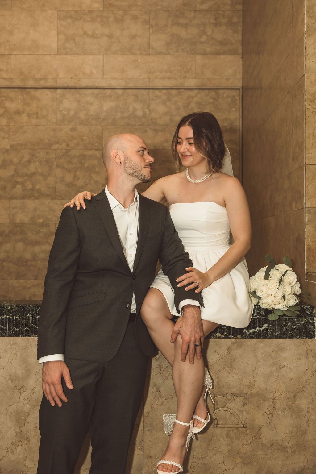 portrait of the newlyweds smiling at each other