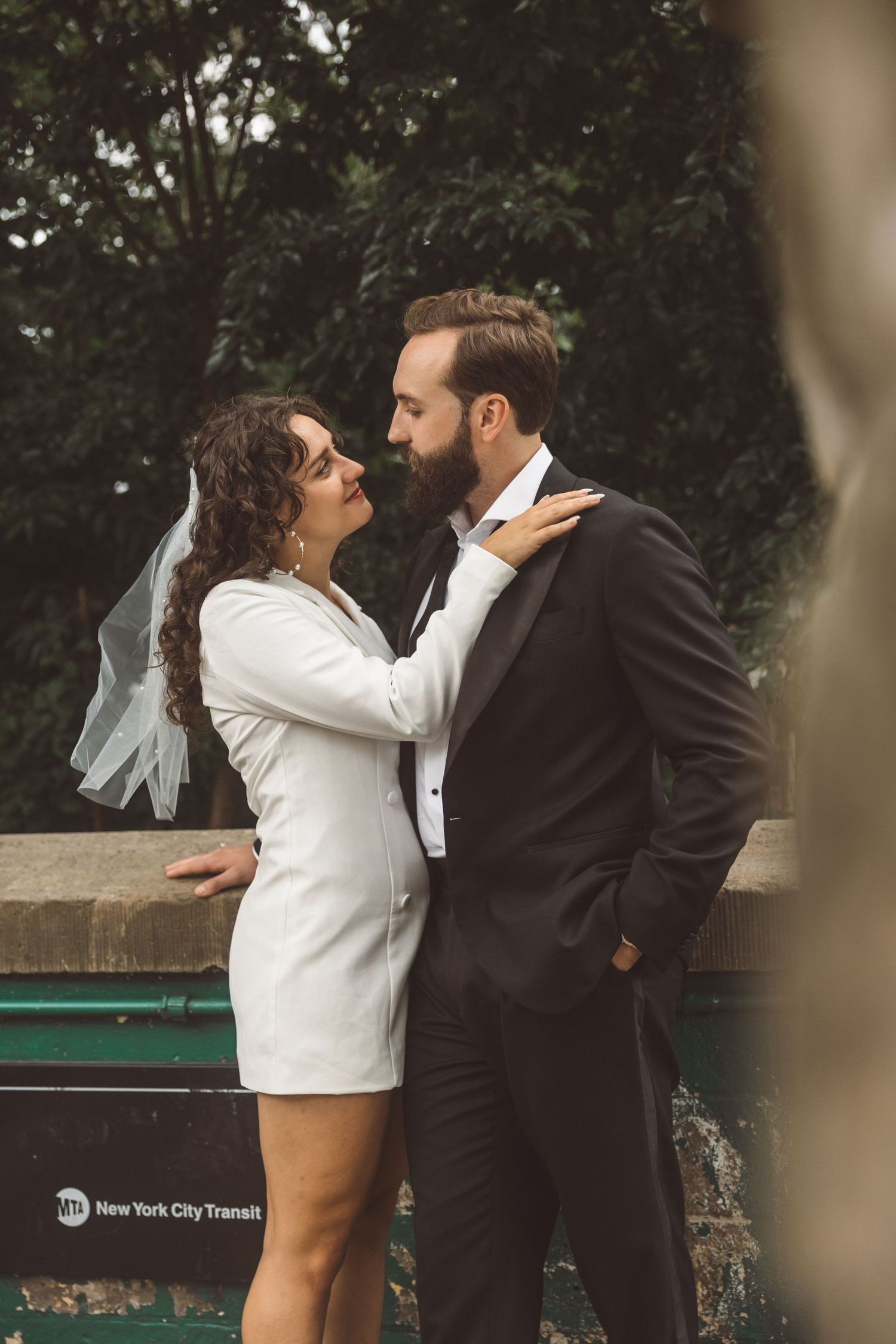 couple smiling at each other during their photoshoot