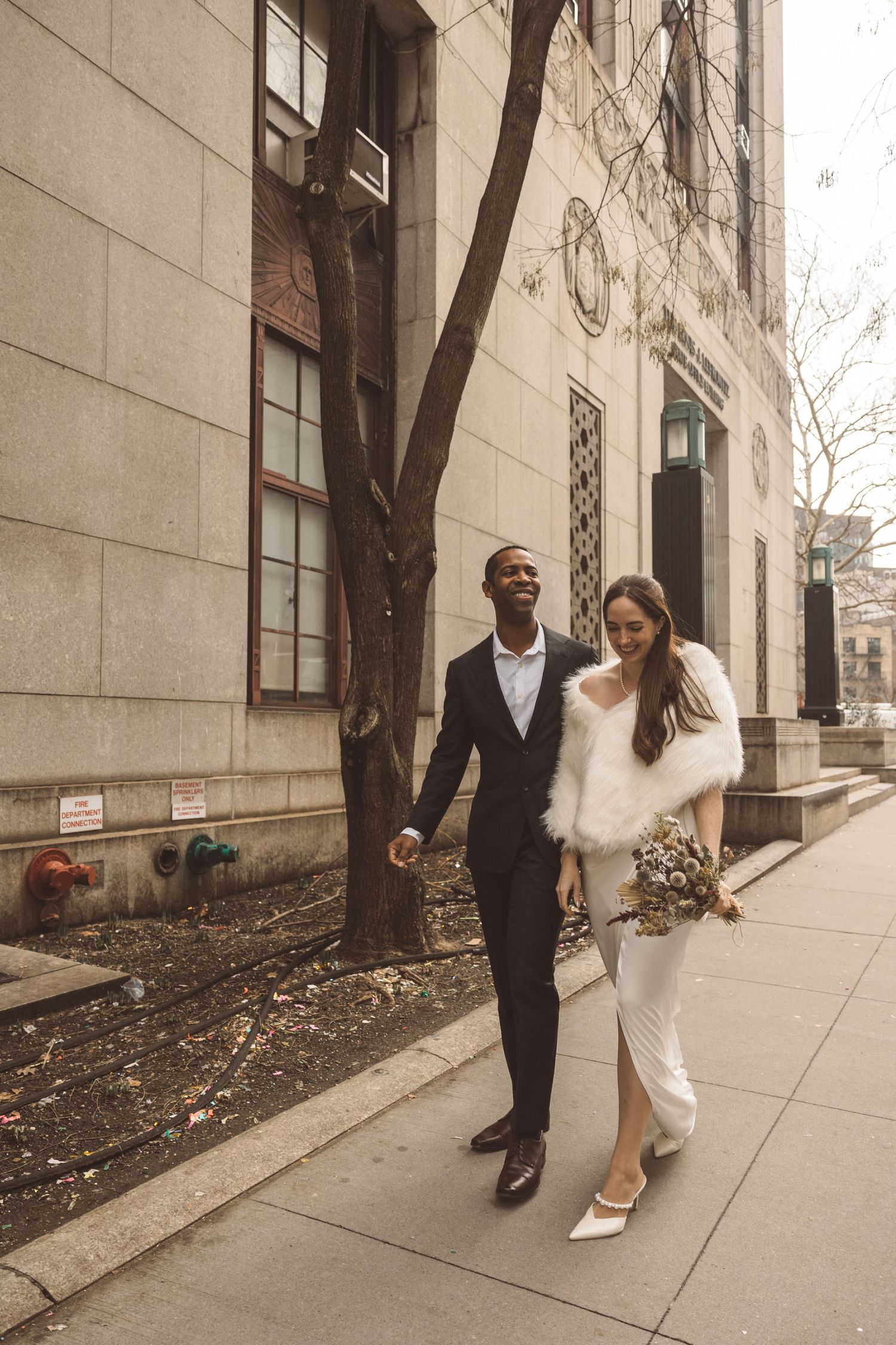 Couple walking around New York during their bridal portraits